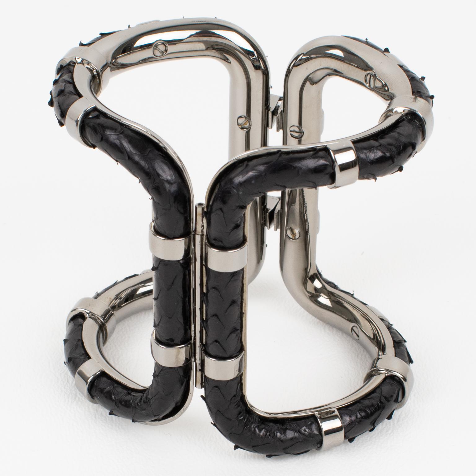 This is a rare Lanvin Paris modernist clamper bracelet. This statement piece features an important gray steel framing in a futuristic design adorned with black python leather. The inside of the bracelet is engraved with the words 