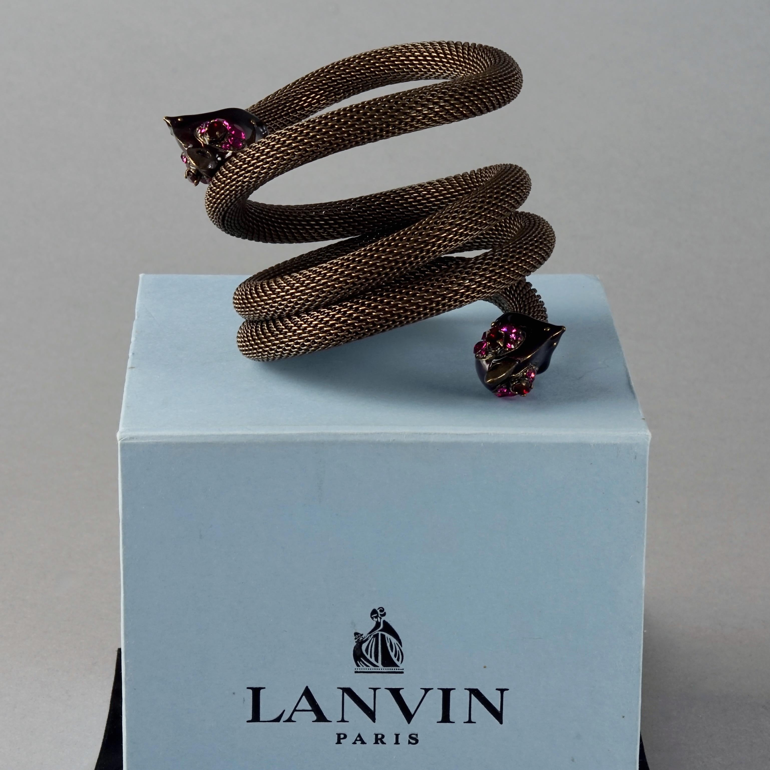 LANVIN PARIS Enamel Rhinestone Bird Four Rows Wrap Around Cuff Bracelet

Measurements:
One size fits all

Features:
- 100% Authentic LANVIN PARIS.
- Coiled wrap around cuff bracelet with purple enamelled bird heads.
- Bird heads are embellished with