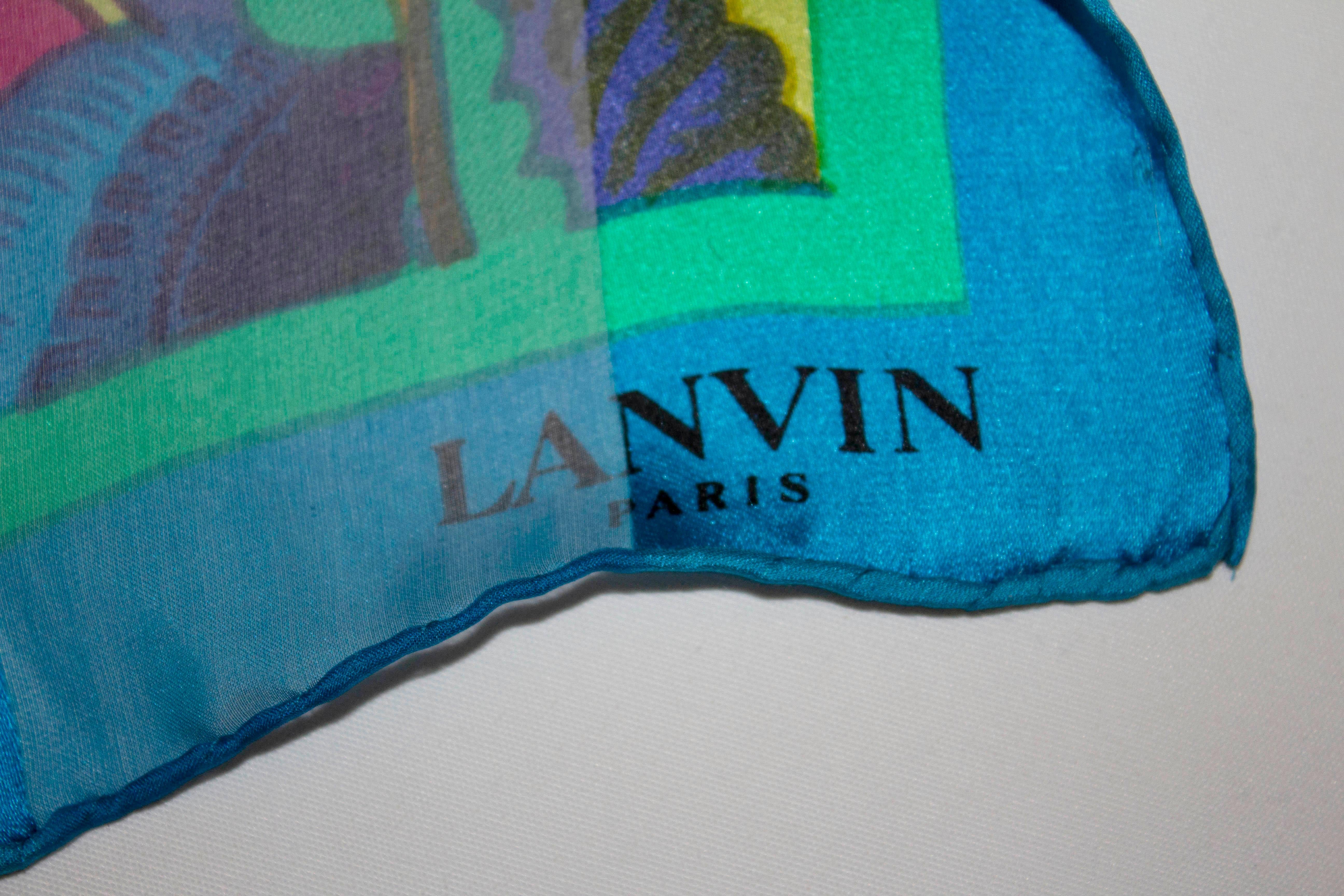 A stunning silk scarf for Spring / Summer by Lanvin Paris. The scarf has hand rolled edge with a blue border, floral design and stripe background. 
Measurements : 35'' x 35''