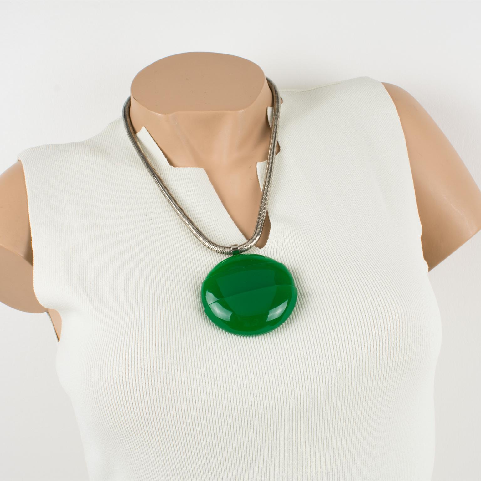 This lovely Lanvin Paris modernist 1970s necklace features an oversized architectural dimensional Lucite pendant in an intense emerald green color. The necklace still has its original silvered metal snake chain with a spring ring-closing clasp. The