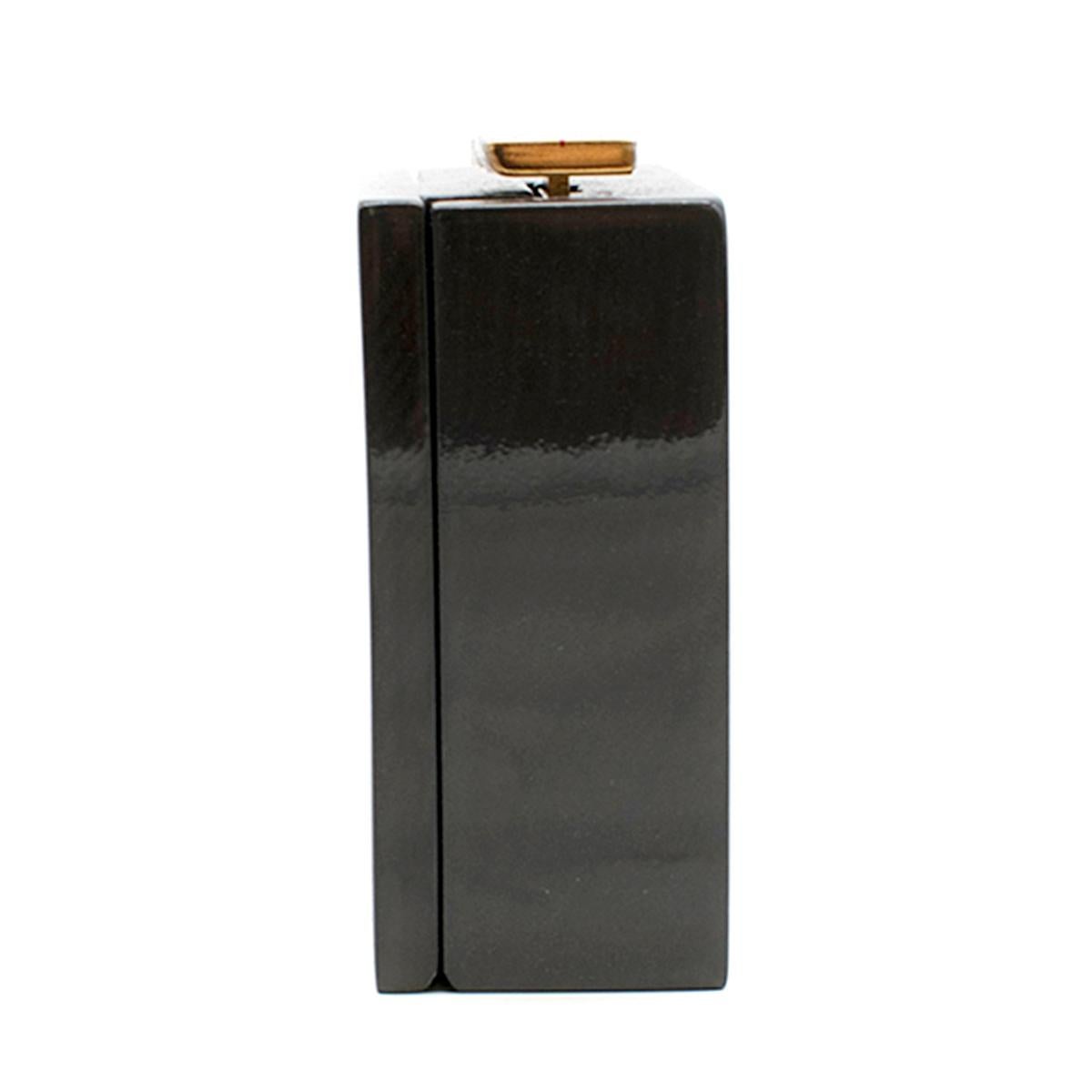 Lanvin Piano Dark Grey Wood Box Clutch 

- Runway edition
- Dark Grey Box Clutch 
- Painted wooden frame, piano-like style 
- Gold toned push clasp fastening closure, hinged base
- Suede goat lining with Lanvin logo embossed
- Strapless 

This item