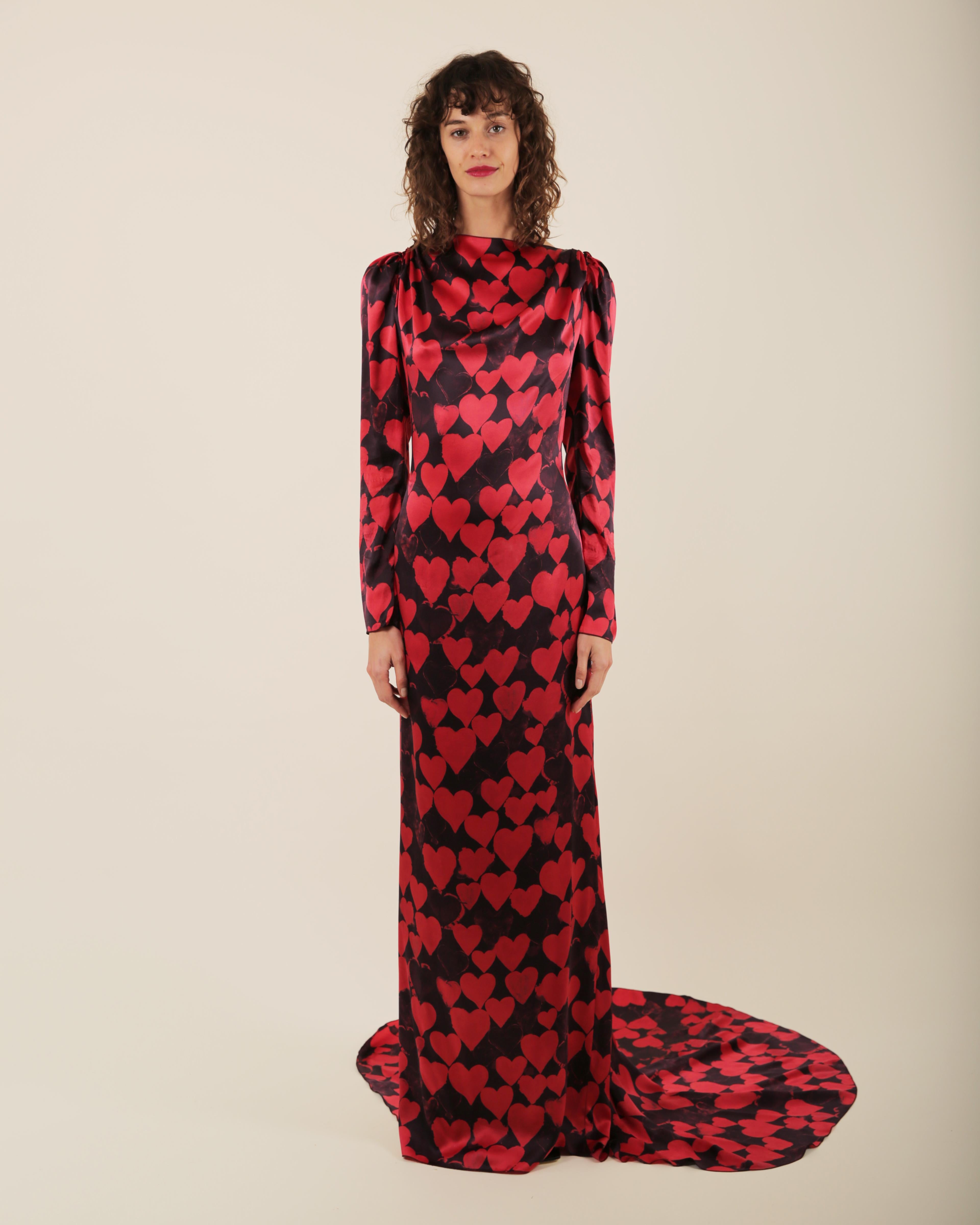 LOVE LALI Vintage

A beautiful floor length silk gown in black, covered in red heart print from Lanvin Pre Fall 2012 which was the 10 year anniversary collection of Alber Elbaz
Long sleeves
Low V cut back with a zip that is concealed by ruffle
