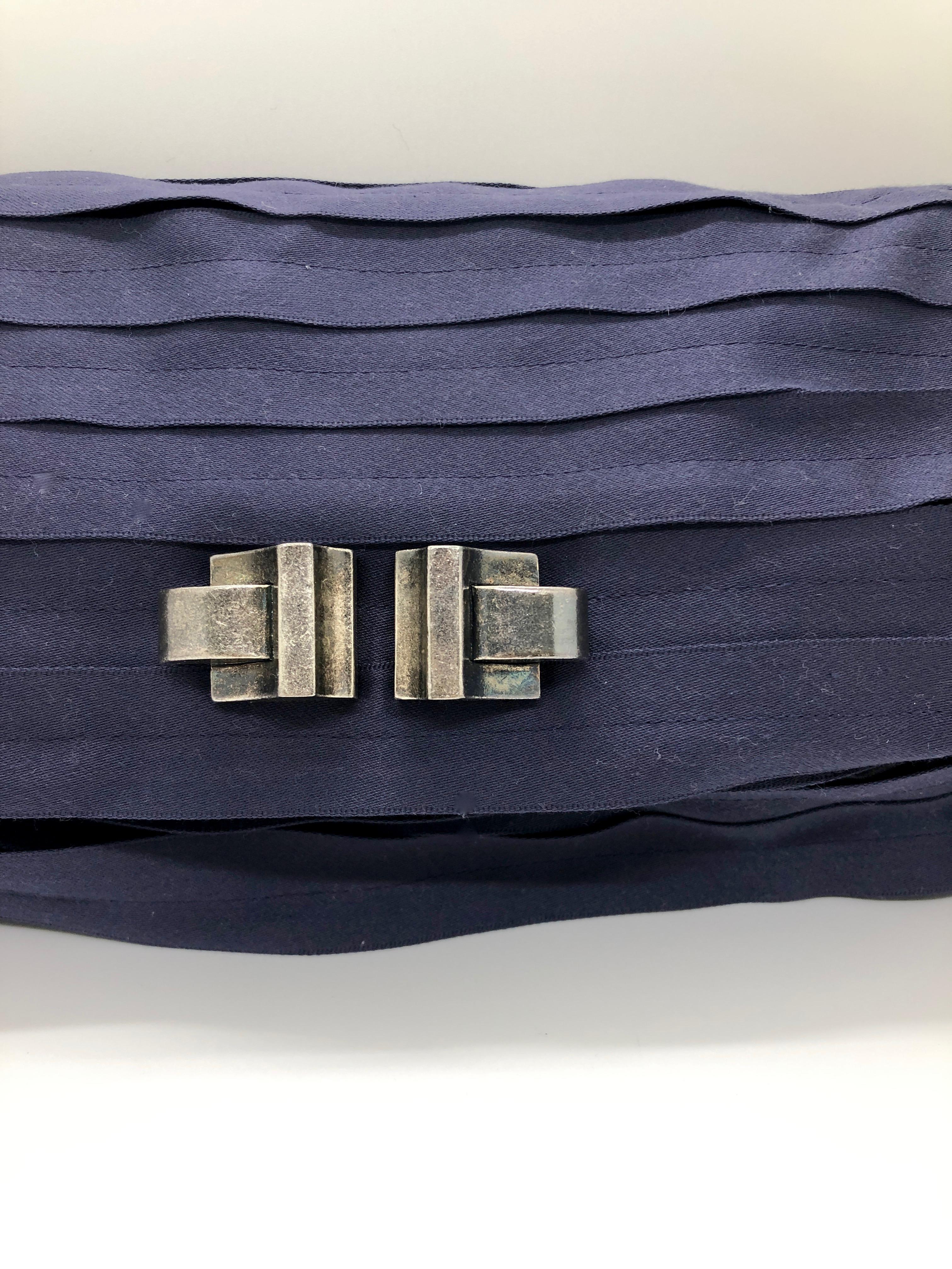 Make:  Lanvin
Headquarters:  Paris, France
Type:  Clutch / evening clutch
Color: Aubergine (deep purple)
Materials: Silk, satin silk and silvered tone metal
Condition:  Very good light use vintage condition
Style:  Rectangular shaped Lanvin clutch