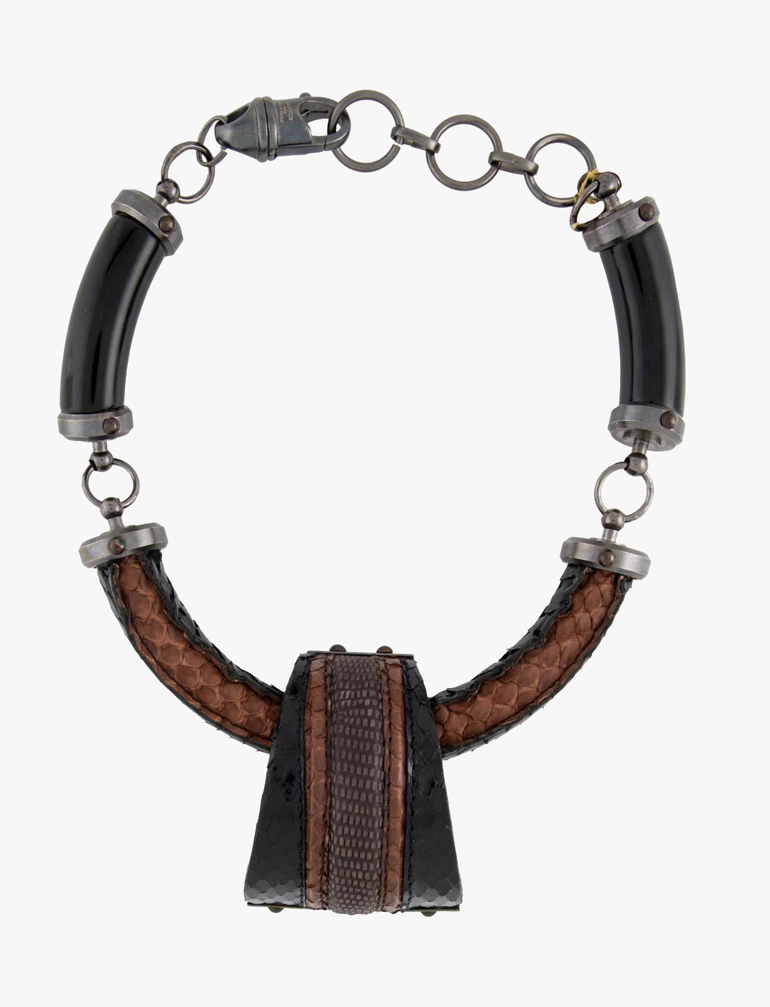 Lanvin necklace made of gunmetal, python, lizard and resin

Length: 43 cm / 17″

Marks – Designer Signature, Made in France

Condition – very good

........Additional information ........

- Photo might be slightly different from actual item in