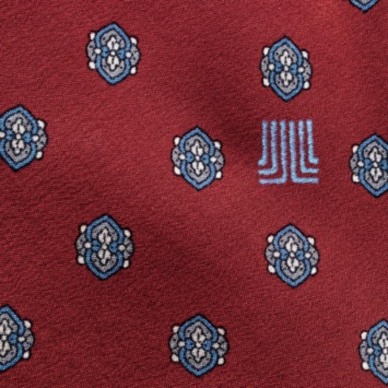 A classic formal accessory, this Lanvin tie is crafted from silk. It is adorned with a contrasting print all over while a brand label keeper loop completes it. Wear it to add a touch of class and finesse to your ensemble.