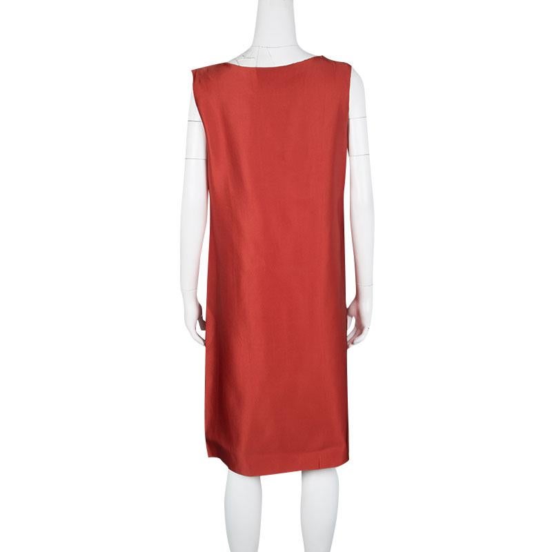 Go bold with this bright red dress by Lanvin. Crafted in a gorgeous silk material, this dress features a drop waist straight fit with a deep V neckline. The front is designed with a drape detailing in layers making this the perfect depiction of your