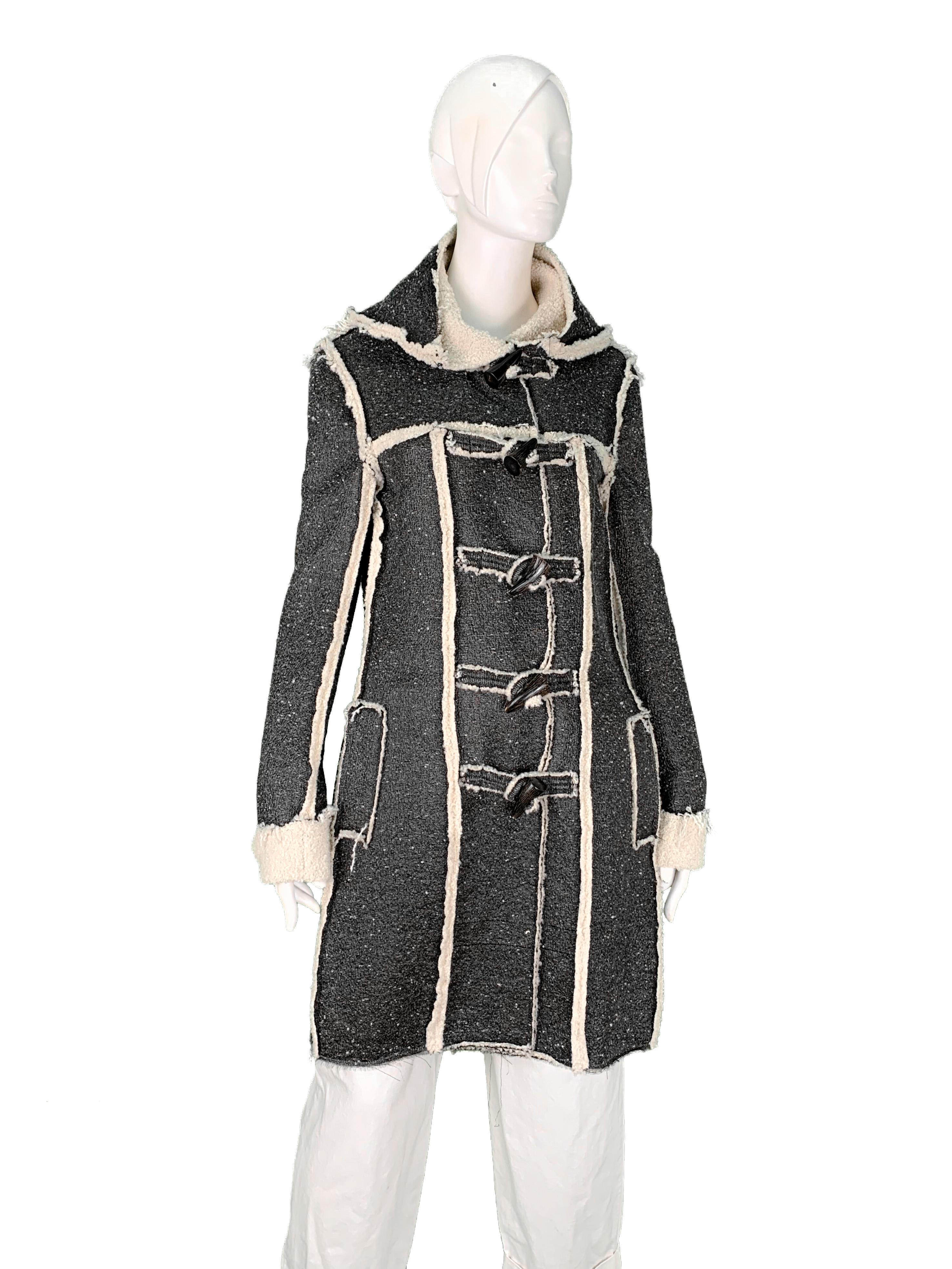 Lanvin by Alber Elbaz Fall 2015 faux shearling silver metallic hooded coat with frilled edges and exposed seams. A  tween of this coat seen as Look 29 of the Pre-Fall collection, awarded a special mention in the Vogue's review as a 