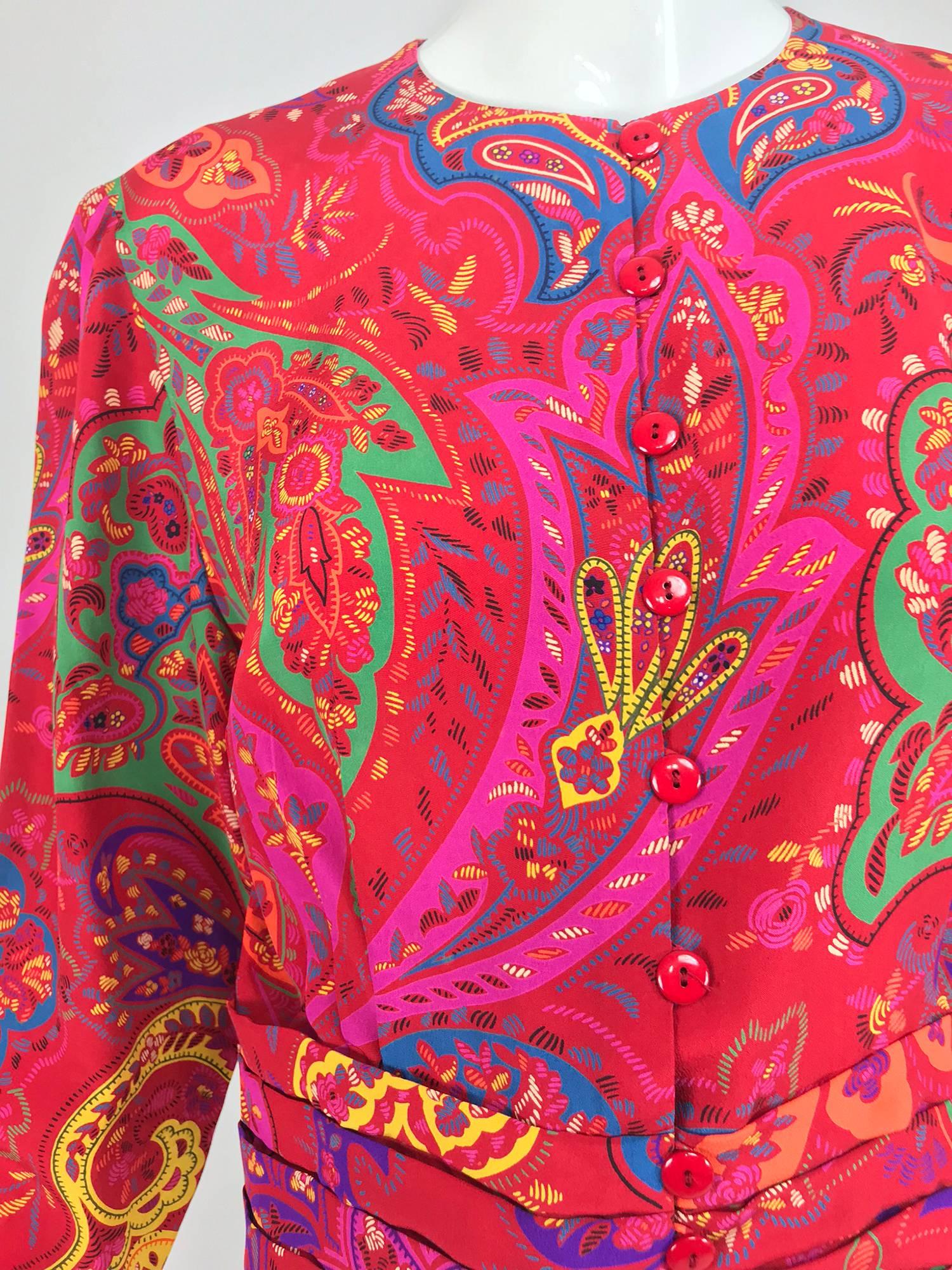 Lanvin silk paisley print top from the late 1980s...Amazing print in bright bold colours, wear this as a top or unlined jacket...Jewel neckline, red buttons close at the front with loops, the long sleeves and fitted waist are pleated...Marked size