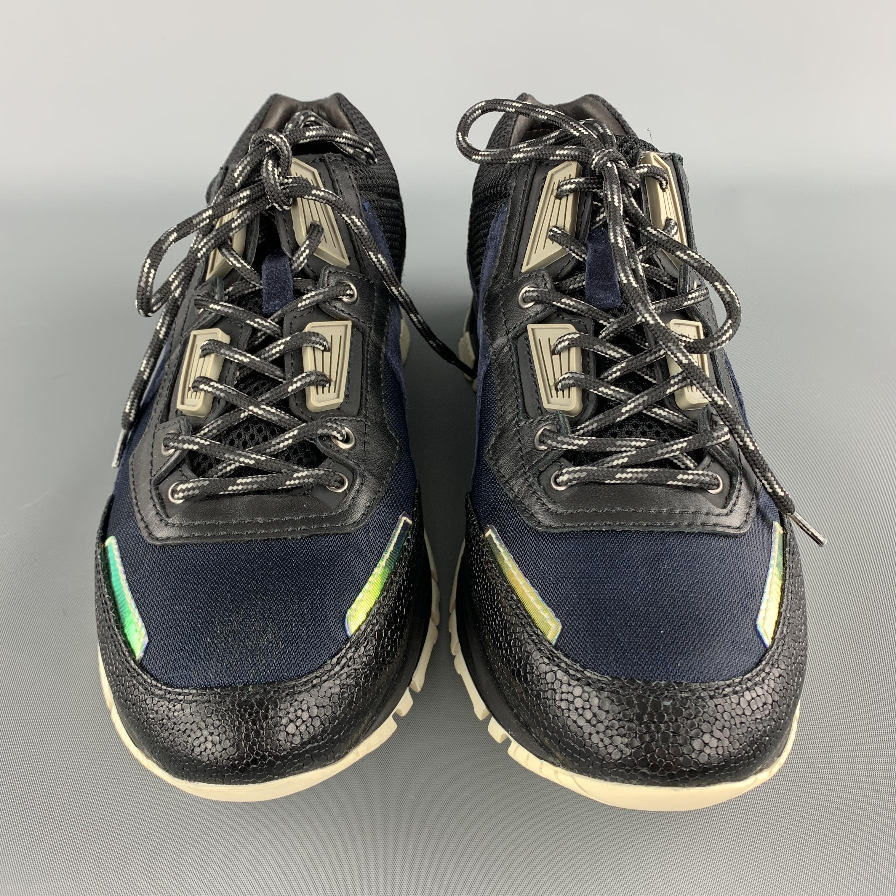 LANVIN sneakers come in navy textured mesh with black leather panels, neon iridescent stripes, and rubber sole. With box. Made in Italy 

Excellent Pre-Owned Condition.
Marked: UK 10

Outsole: 12 x 4.25 in.
