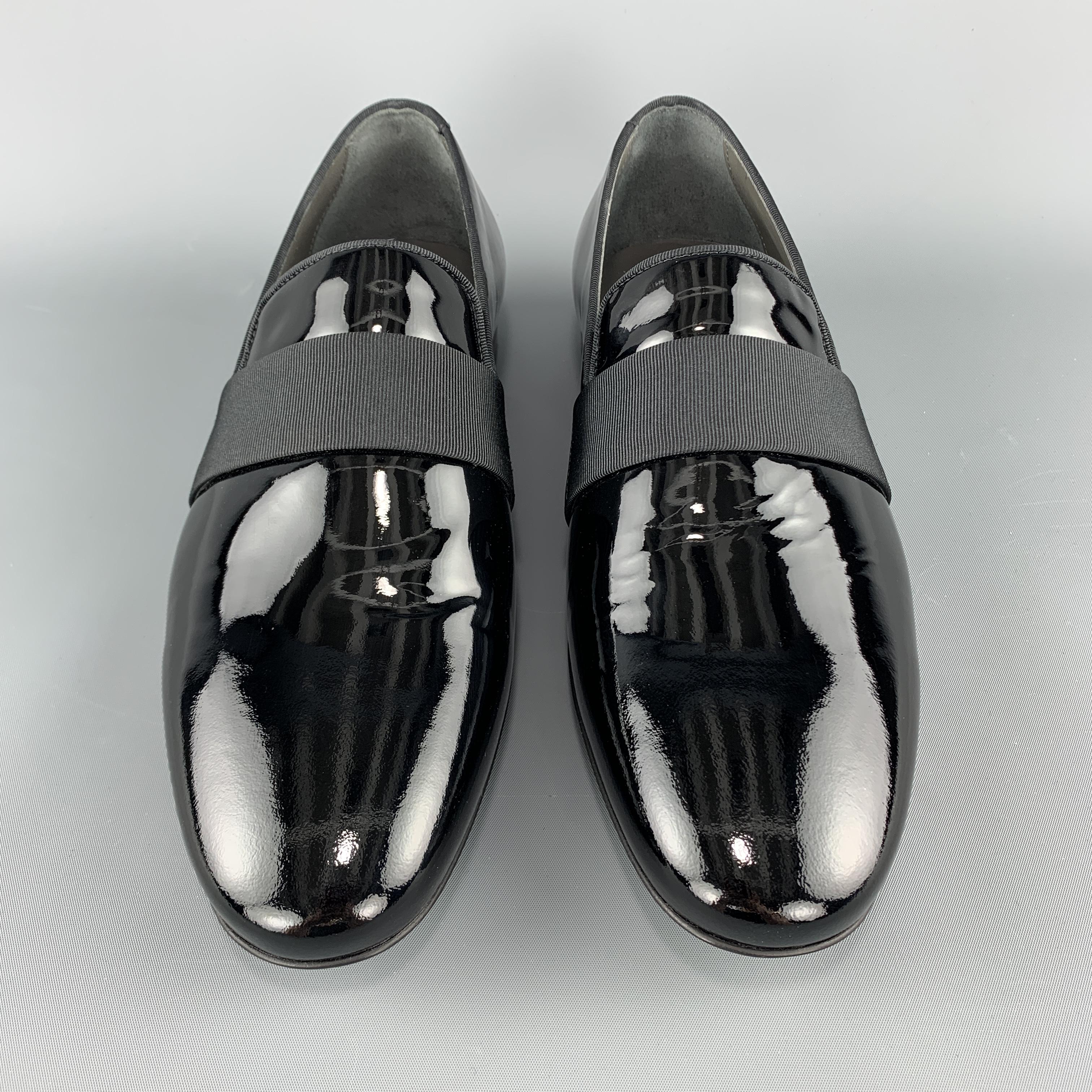 LANVIN tuxedo slippers come in black patent leather with piping and ribbon strap detail. Made in Portugal.

New with Box.
Marked:
Original Retail Price: $625.00

Outsole: 11.25 x 3.75 in.

