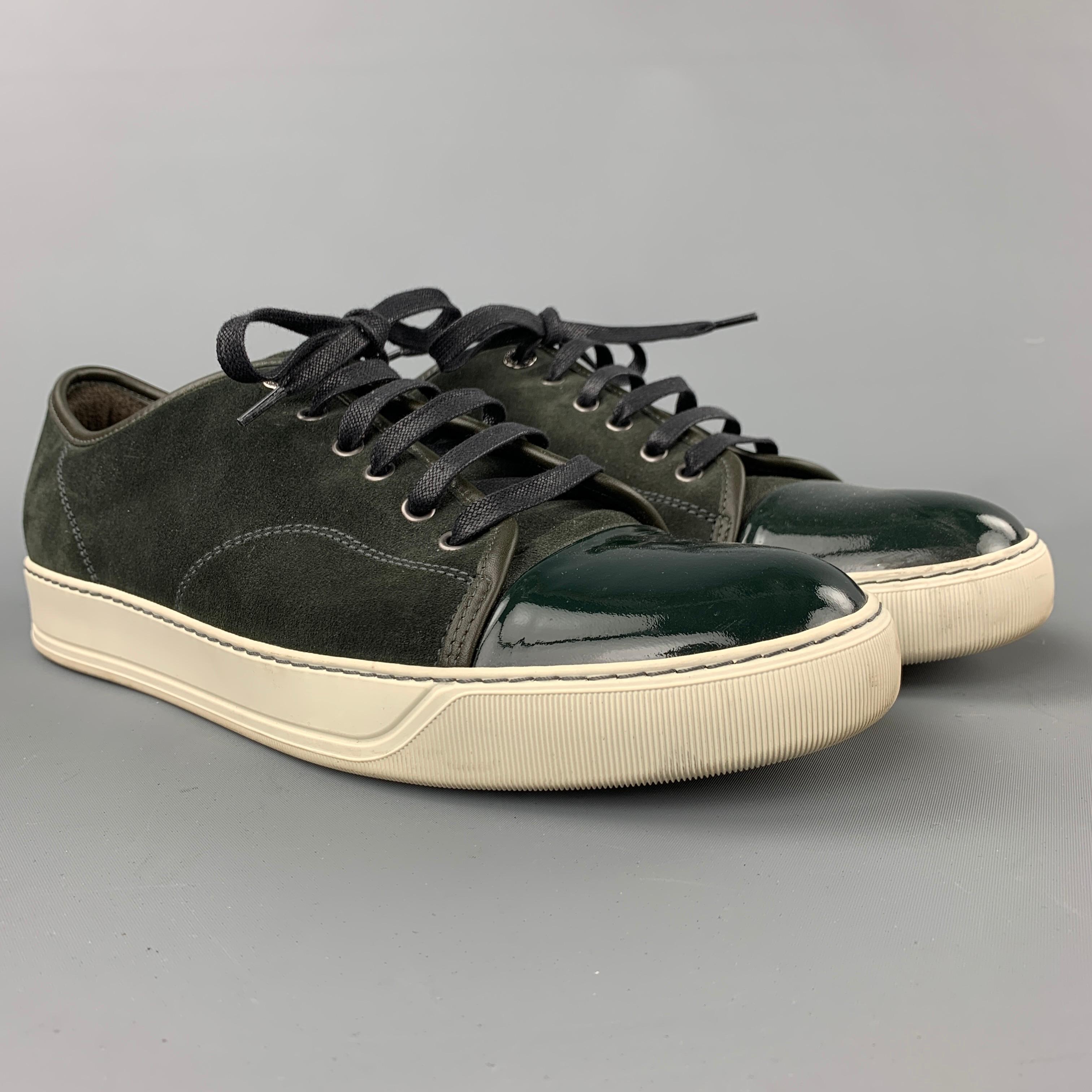 LANVIN sneakers coms in a olive suede with a patent leather toe design featuring a cap te, rubber sole, and a lace up closure. Made in Portugal.

Very Good Pre-Owned Condition.
Marked: 10

Outsole: 12 in. x 4 in. 