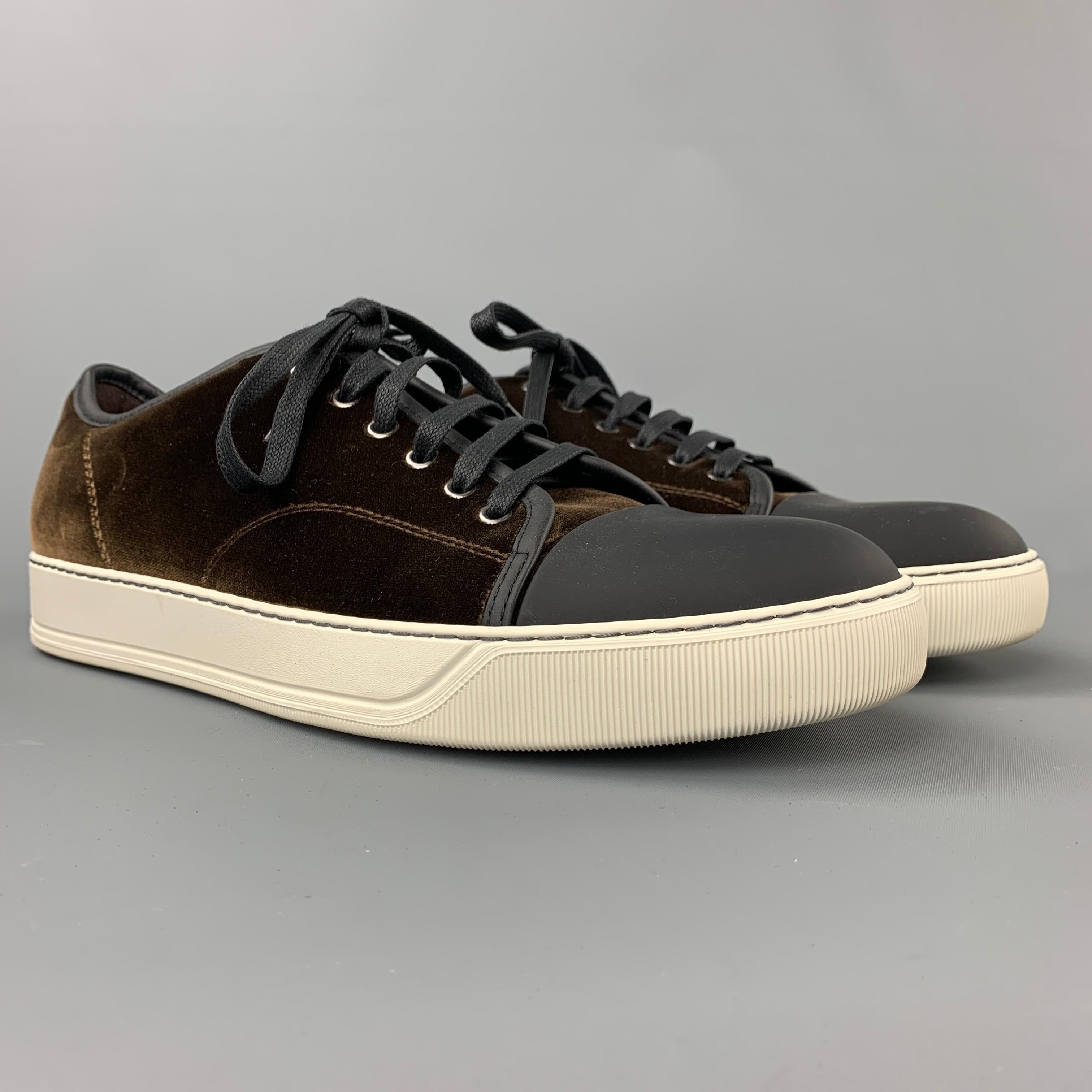 LANVIN sneakers comes in a brown velvet with a black cap toe design featuring a rubber sole and a lace up closure. Made in Portugal.

Excellent Pre-Owned Condition.
Marked: 10
Original Retail Price: $490.00

Outsole: 12 in. x 4 in. 
