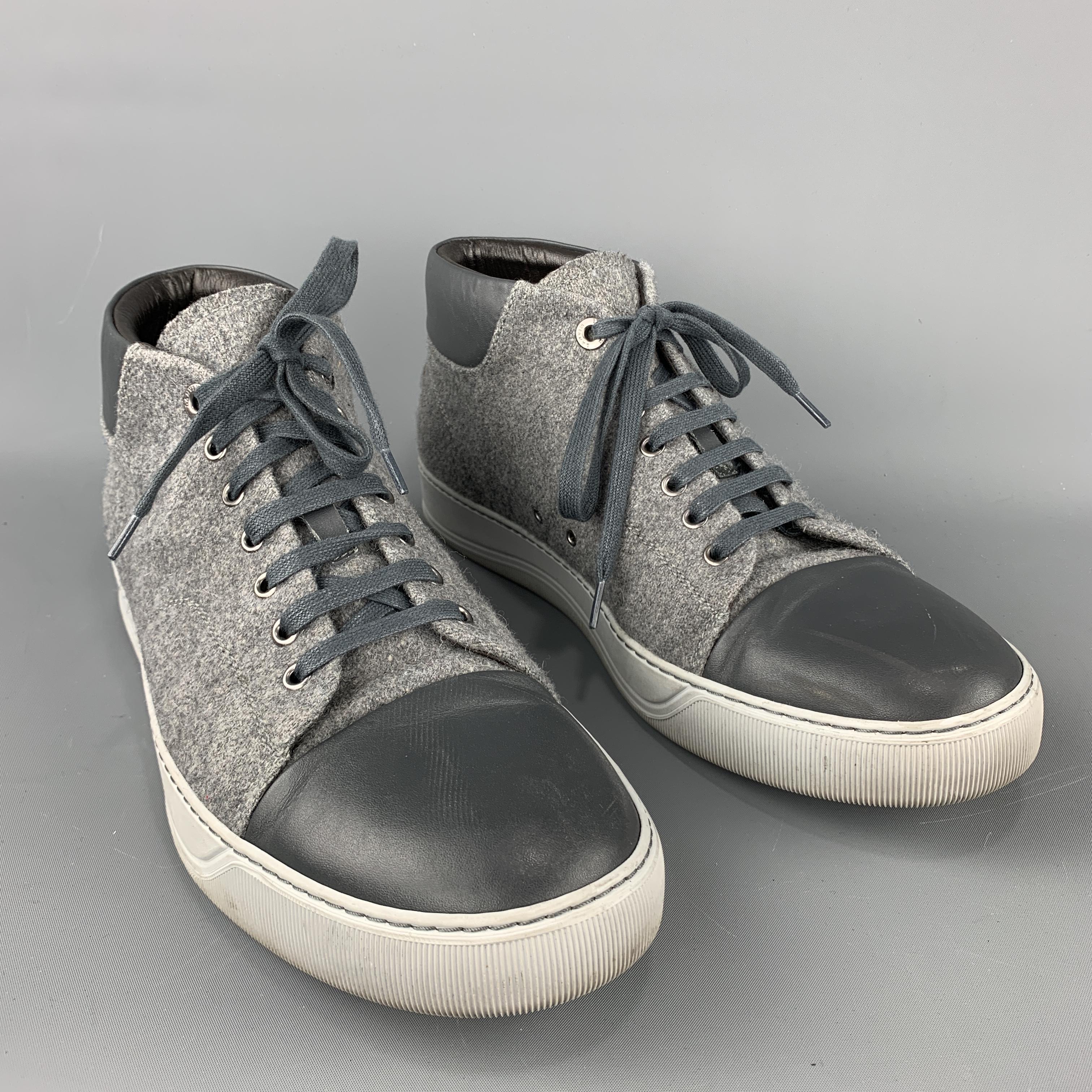 LANVIN Sneakers comes in grey tones in a solid wool material, with a leather trim, a high top, a cap toe, a rubber sole, lace up. Minor wear. Made in Portugal.

Very Good Pre-Owned Condition.
Marked: 10

Outsole: 4.5 x 12.5 in.