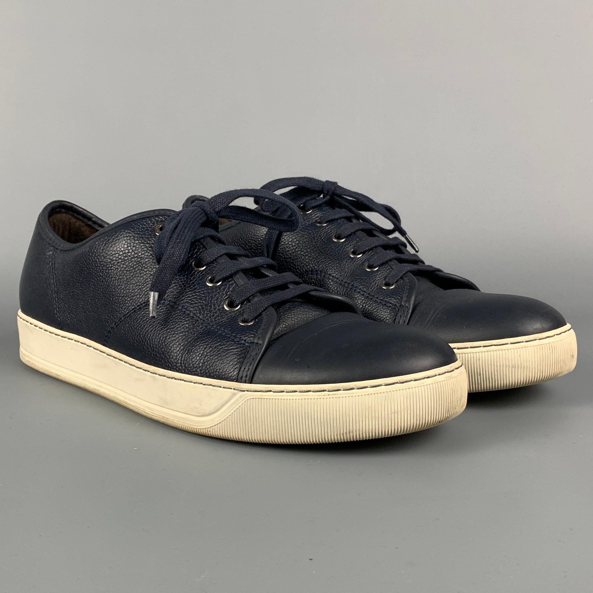 LANVIN sneakers comes in a navy leather featuring a cap toe, white rubber sole, and a lace up closure. Made in Portugal. 

Good Pre-Owned Condition.
Marked: 10

Outsole: 12 in. x 4.25 in. 