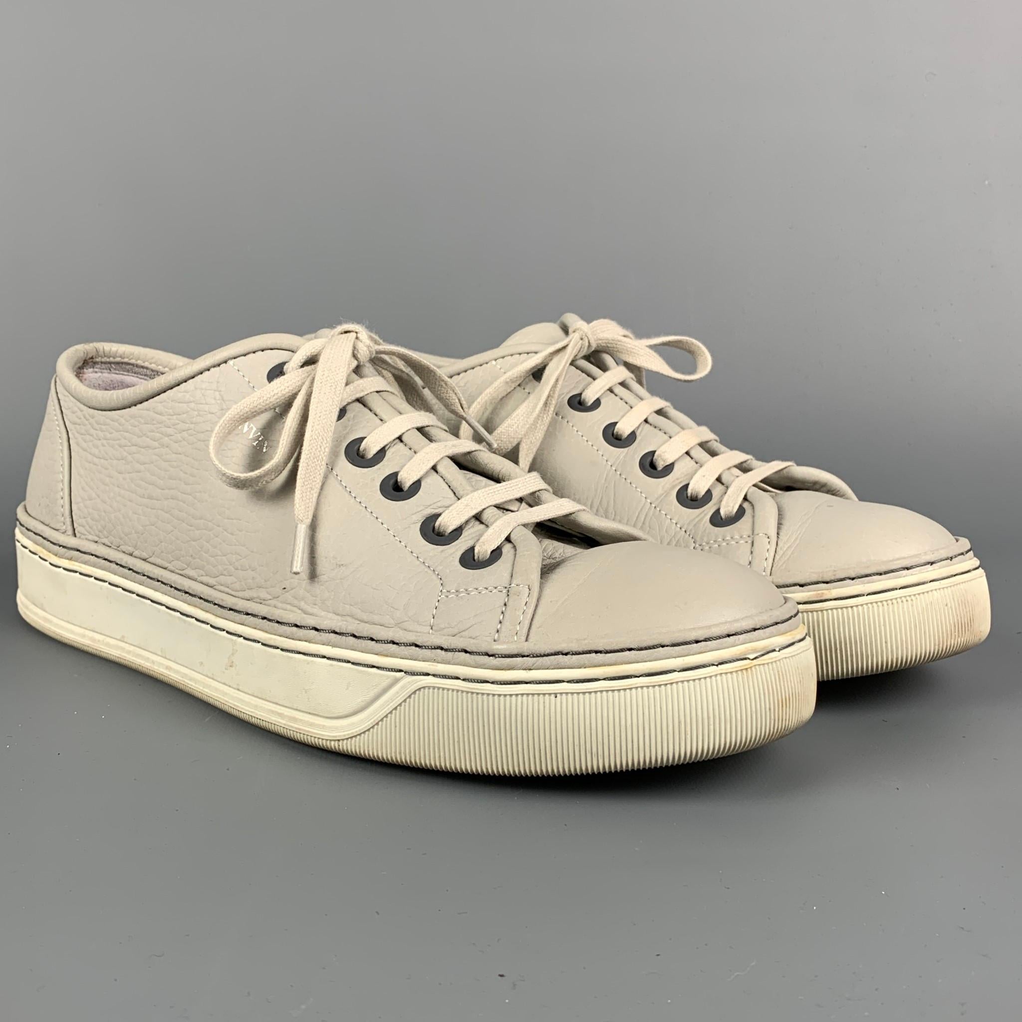 LANVIN sneakers comes in a light gray & white leather featuring a rubber sole and a lace up closure. Made in Portugal. 

Good Pre-Owned Condition. Light wear throughout.
Marked: 10

Outsole: 12 in. x 4.25 in. 