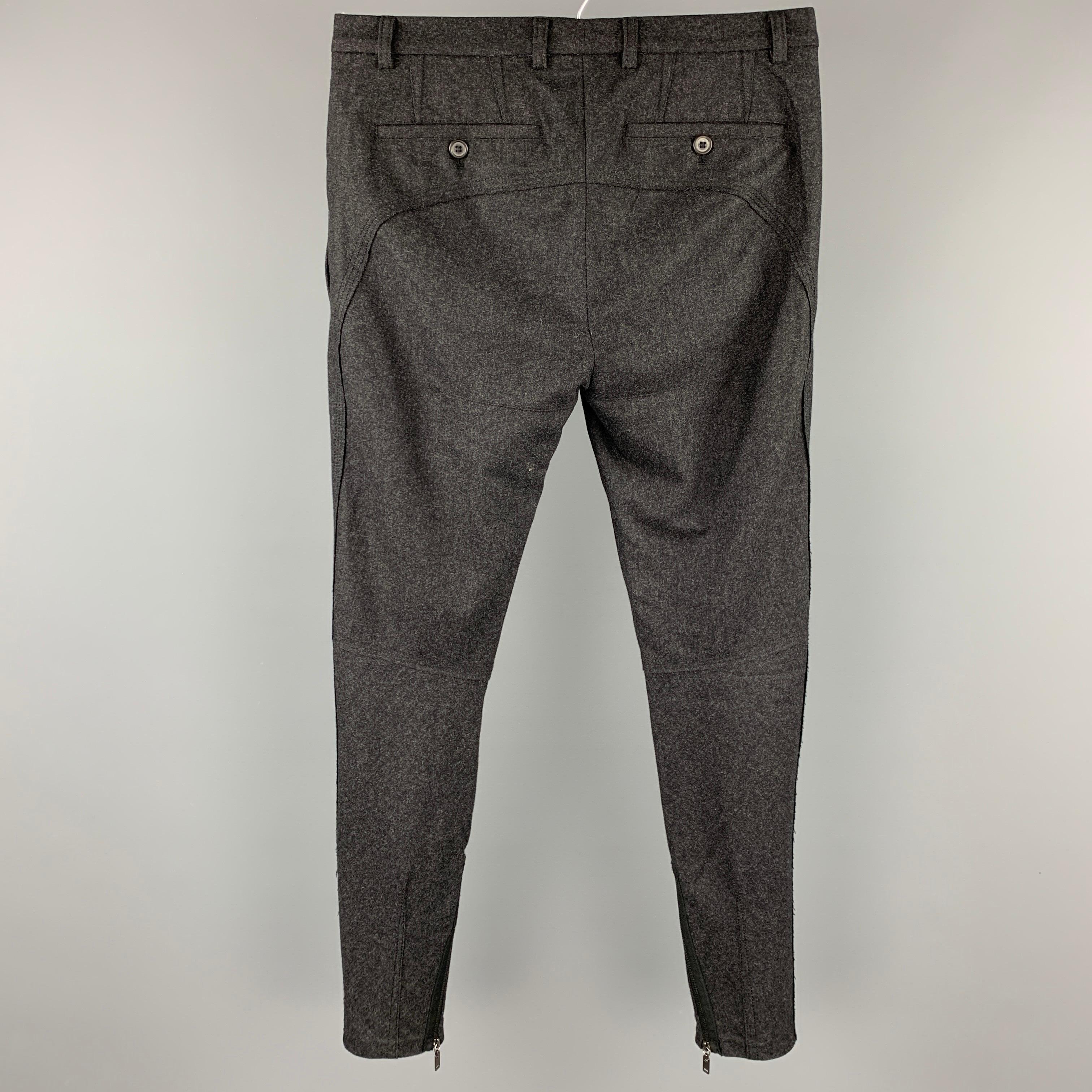 LANVIN dress pants comes in a charcoal heather sable featuring a narrow leg, zipper ankle details, and a zip fly closure. Made in Romania.

Very Good Pre-Owned Condition.
Marked: Size not visible

Measurements:

Waist: 30 in.
Rise: 10 in.
Inseam: 29