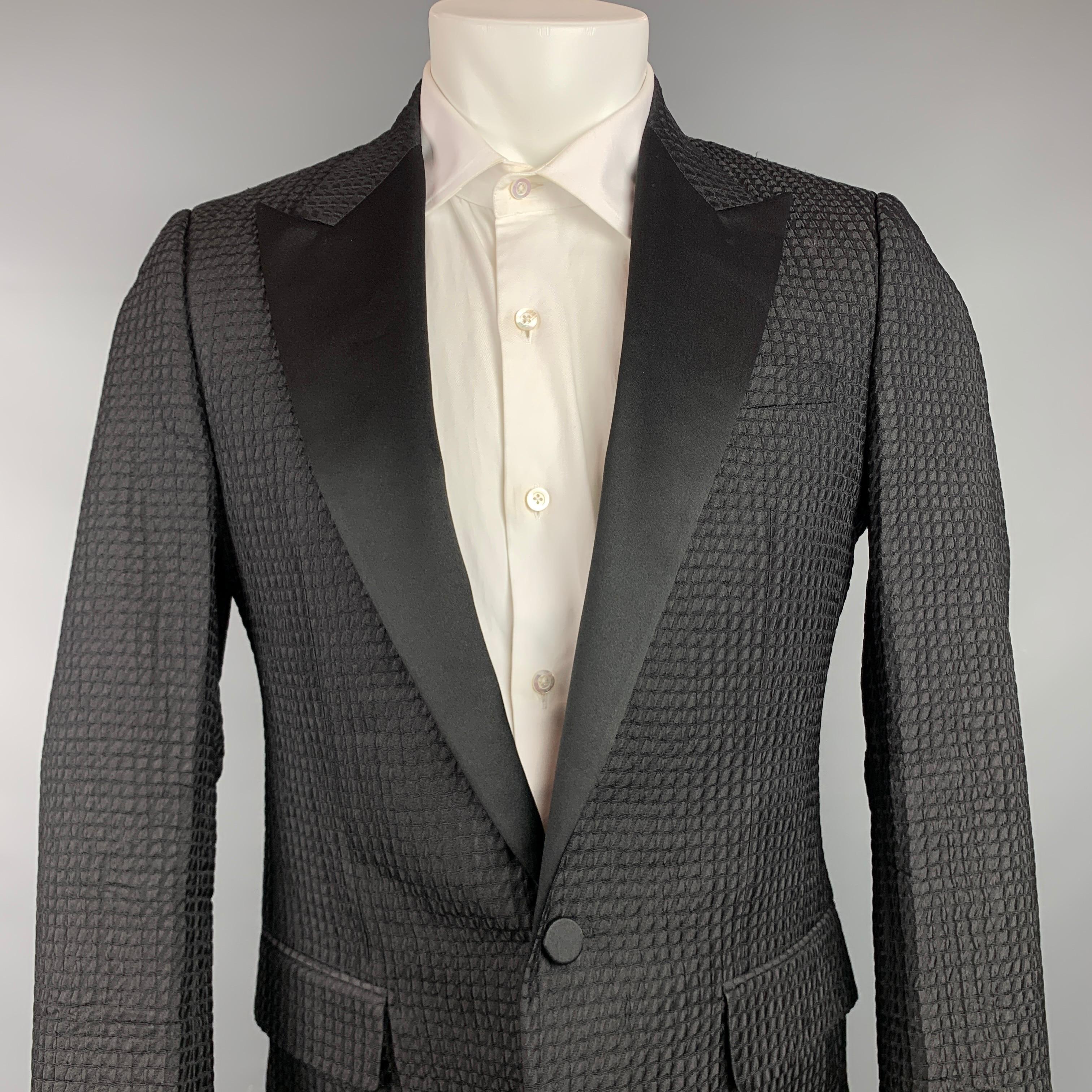 LANVIN sport coat comes in a black textured silk / polyester with a full liner featuring a peak lapel, flap pockets, and a single button closure. Made in Italy.

Very Good Pre-Owned Condition.
Marked: 48

Measurements:

Shoulder: 16.5 in.
Chest: 38