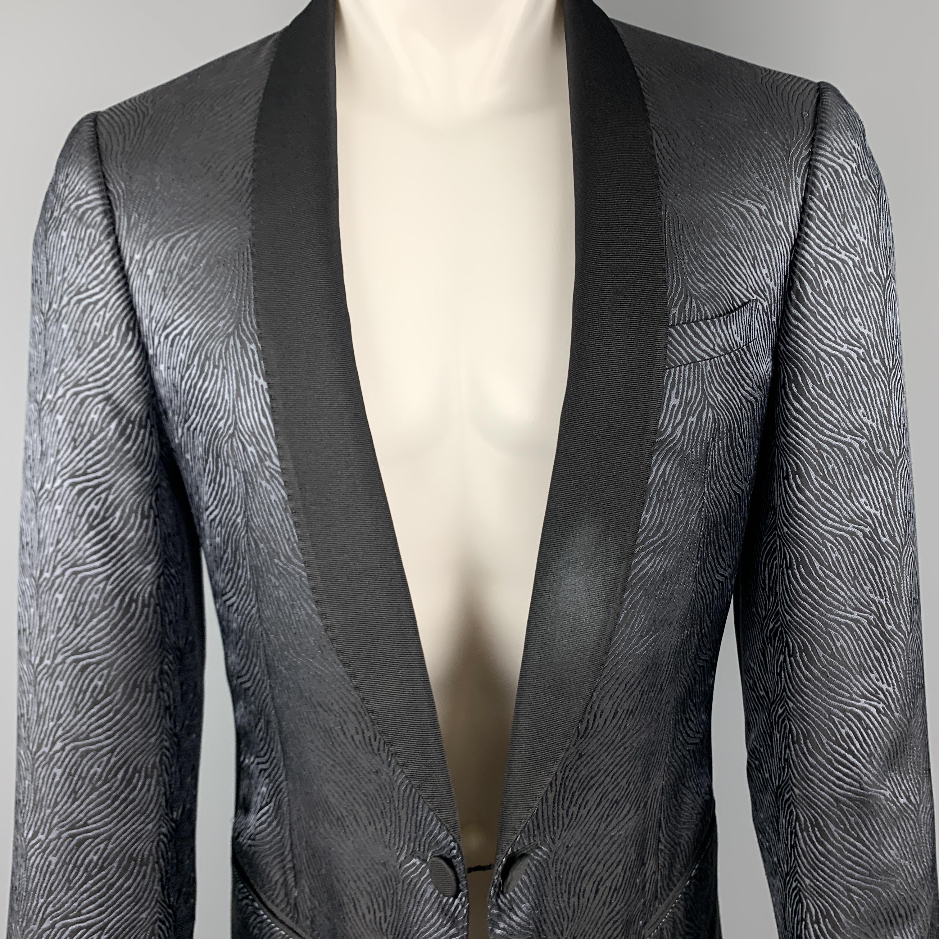 LANVIN dinner jacket comes in blue and black animal print satin with a faille shawl collar and link closure. Imperfection on lapel. As-is.  Made in Italy.

Good Pre-Owned Condition.
Marked: IT 50

Measurements:

Shoulder:16 in.
Chest: 40 in.
Sleeve: