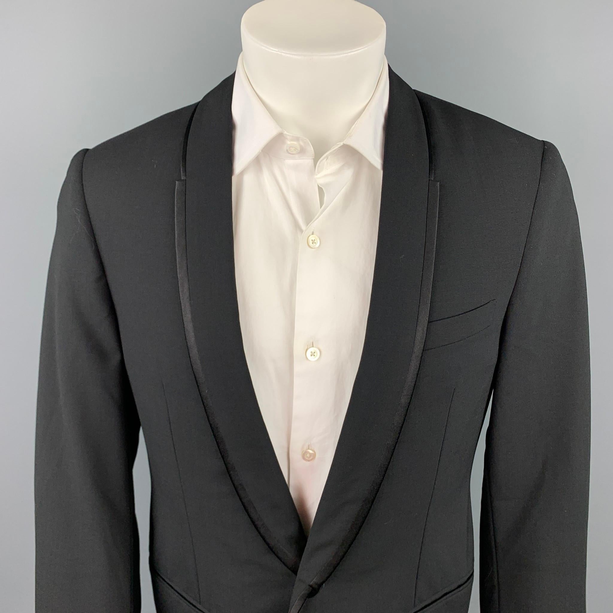 LANVIN sport coat comes in a black wool / lycra with a full liner featuring a shawl lapel, slit pockets, and a single button closure. Made in Italy.

Very Good Pre-Owned Condition.
Marked: 50

Measurements:

Shoulder: 18 in.
Chest: 40 in.
Sleeve: 27