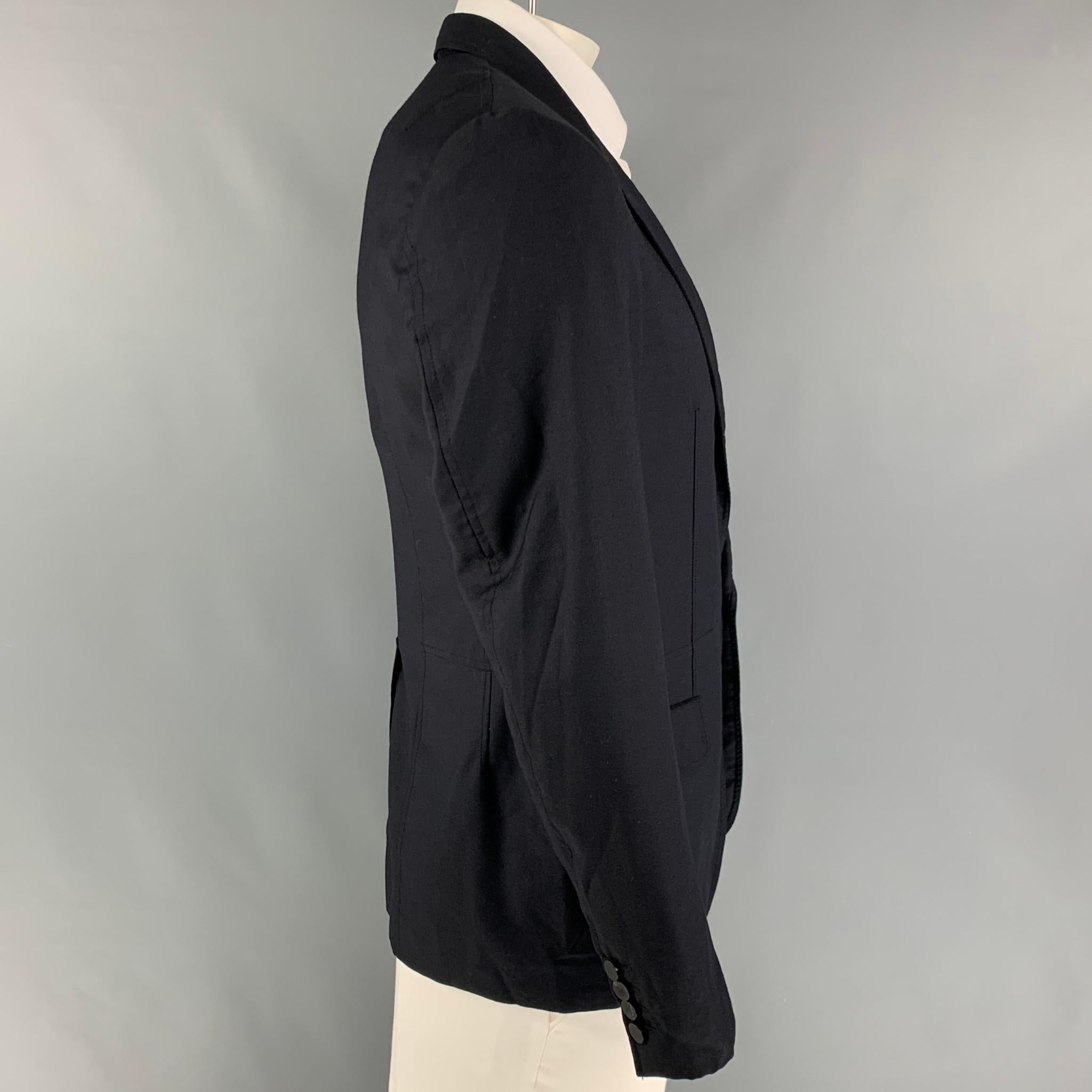 LANVIN sport coat comes in a navy cupro with a full liner featuring a notch lapel, flap pockets, single back vent, and a single button closure. Made in Italy. 

Very Good Pre-Owned Condition.
Marked: 52

Measurements:

Shoulder: 17 in.
Chest: 42