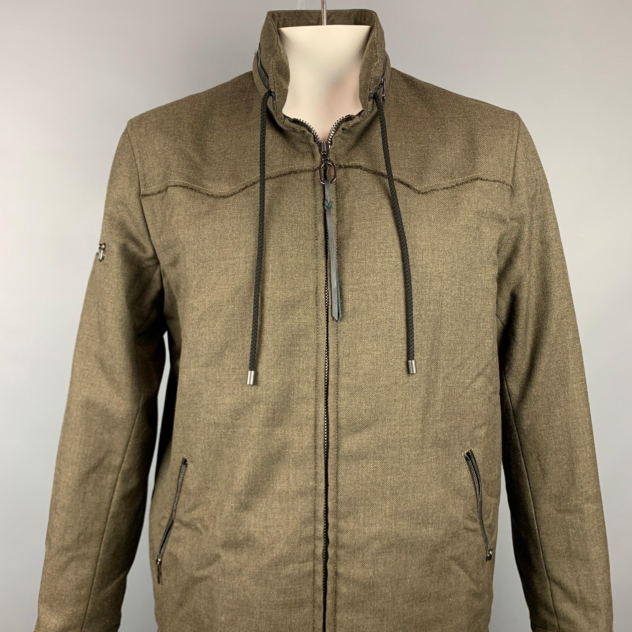 LANVIN jacket comes in a olive wool with a full liner featuring a adjustable hooded design, strap details, high collar, drawstring, ad a full zip up closure. Made in Romania.

Very Good Pre-Owned Condition.
Marked: EU 52

Measurements:

Shoulder: