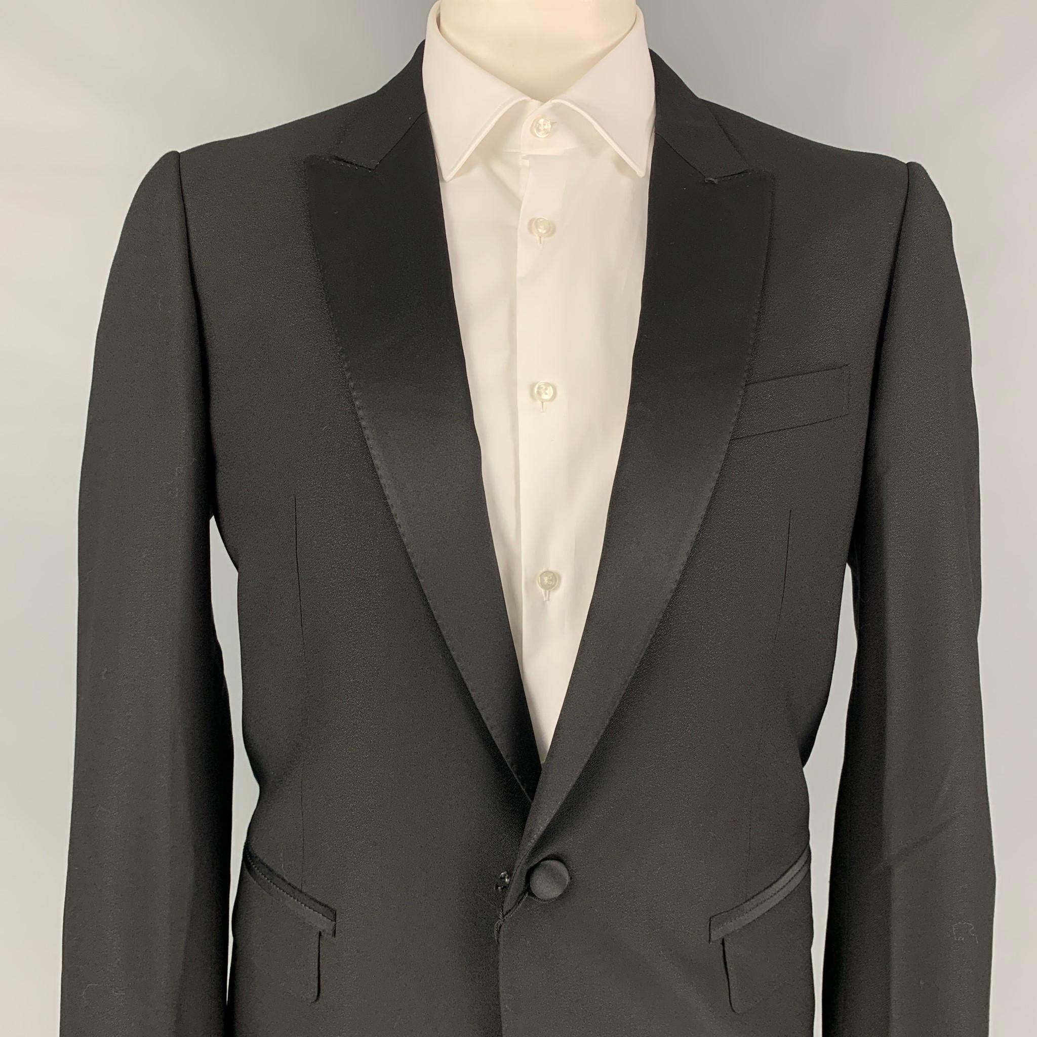 LANVIN sport coat comes in a black wool with a full liner featuring a peak lapel, flap pockets, single back vent, and a single button closure. Made in Italy. 

New With Tags. 
Marked: 54

Measurements:

Shoulder: 18 in.
Chest: 44 in.
Sleeve: 27