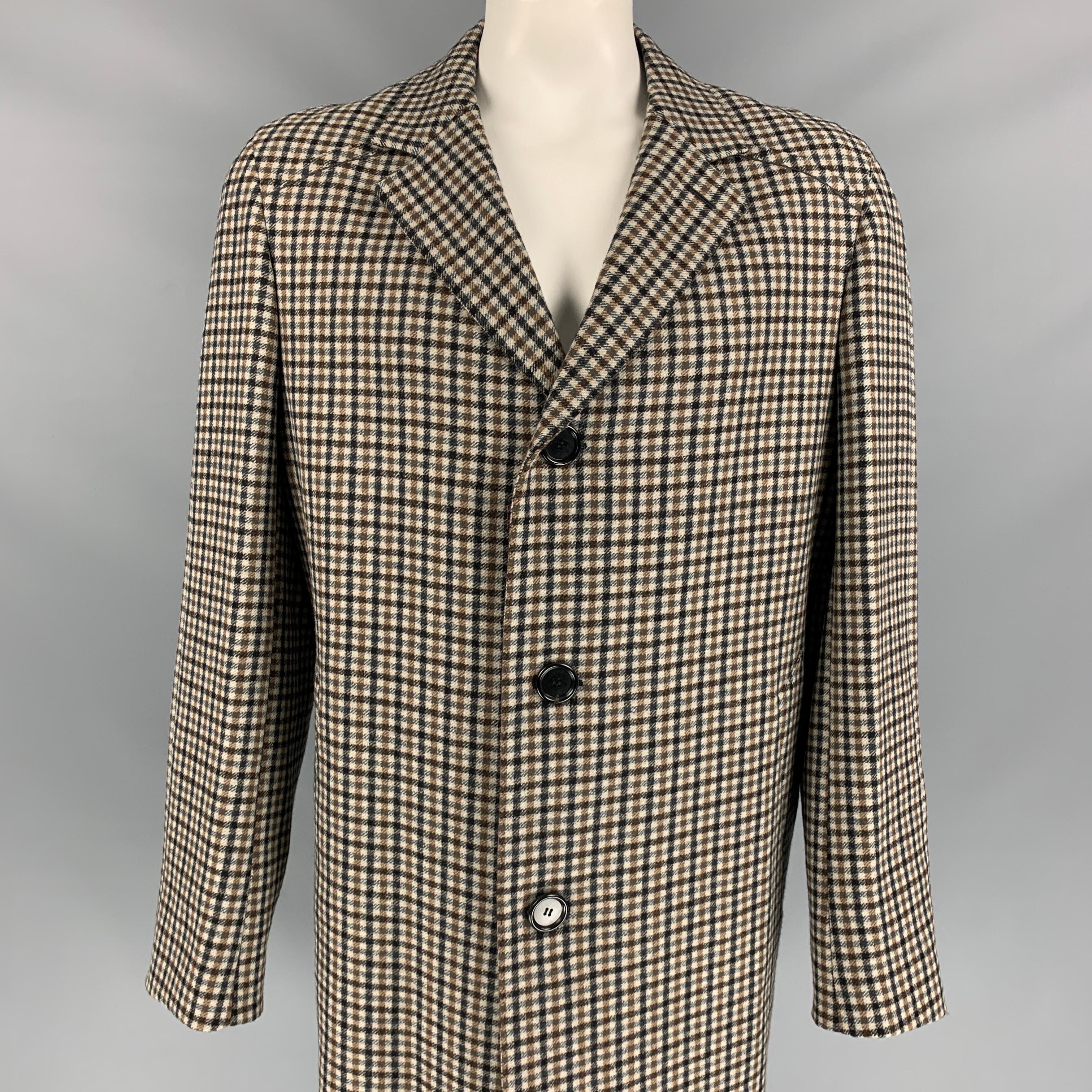 LANVIN coat comes in a oatmeal & black checkered wool with a full liner featuring a notch lapel, slit pockets, single back vent, and a buttoned closure. Made in Italy. 

Very Good Pre-Owned Condition.
Marked: 54 8 R

Measurements:

Shoulder: 19.5