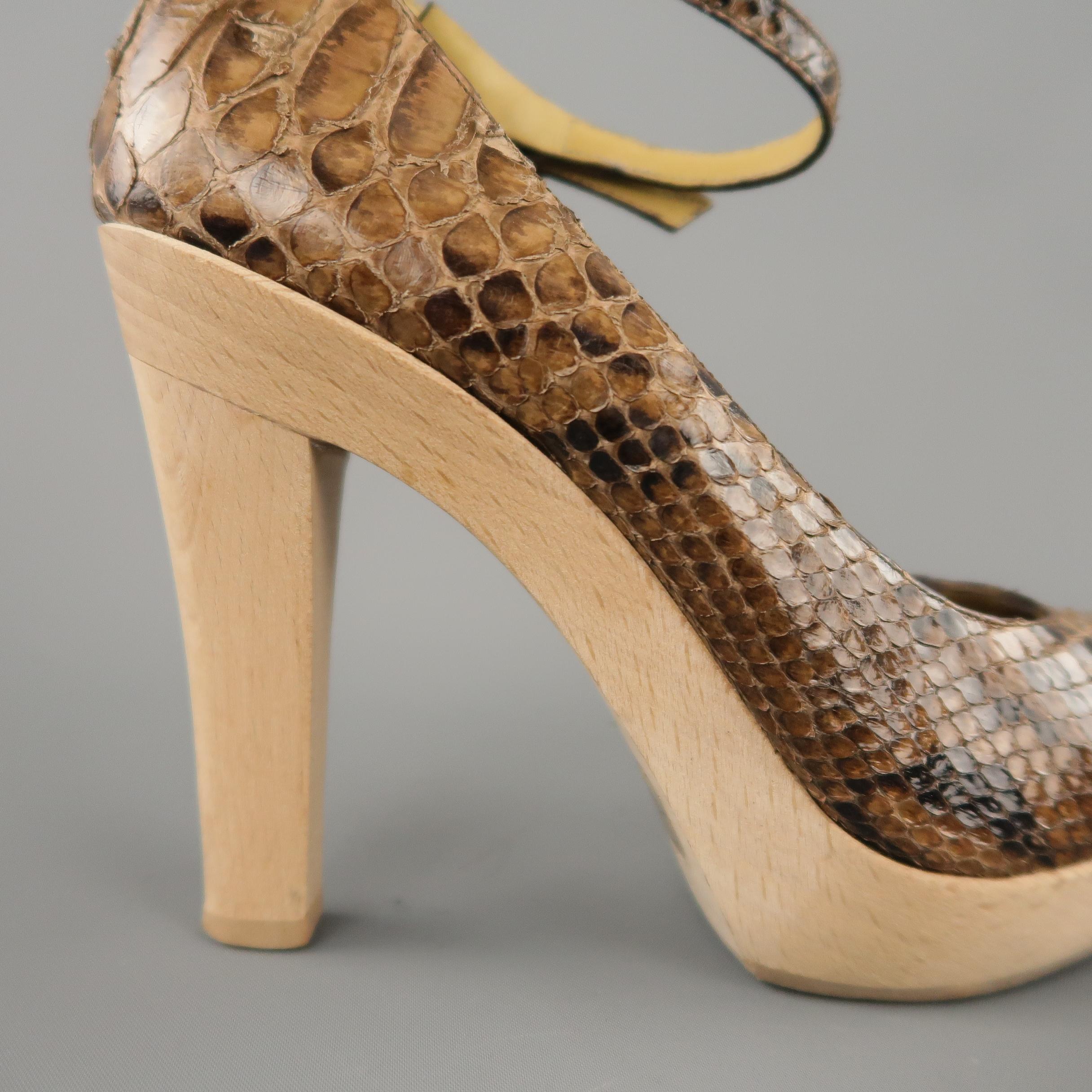 LANVIN D'orsay pumps come in tan snakeskin leather with a rounded toe, skinny ankle strap, and wooden platform with chunky heel.
 
Excellent Pre-Owned Condition.
Marked: IT 36
 
Measurements:
 
Heel: 4.5 in.
Platform: 1 in.