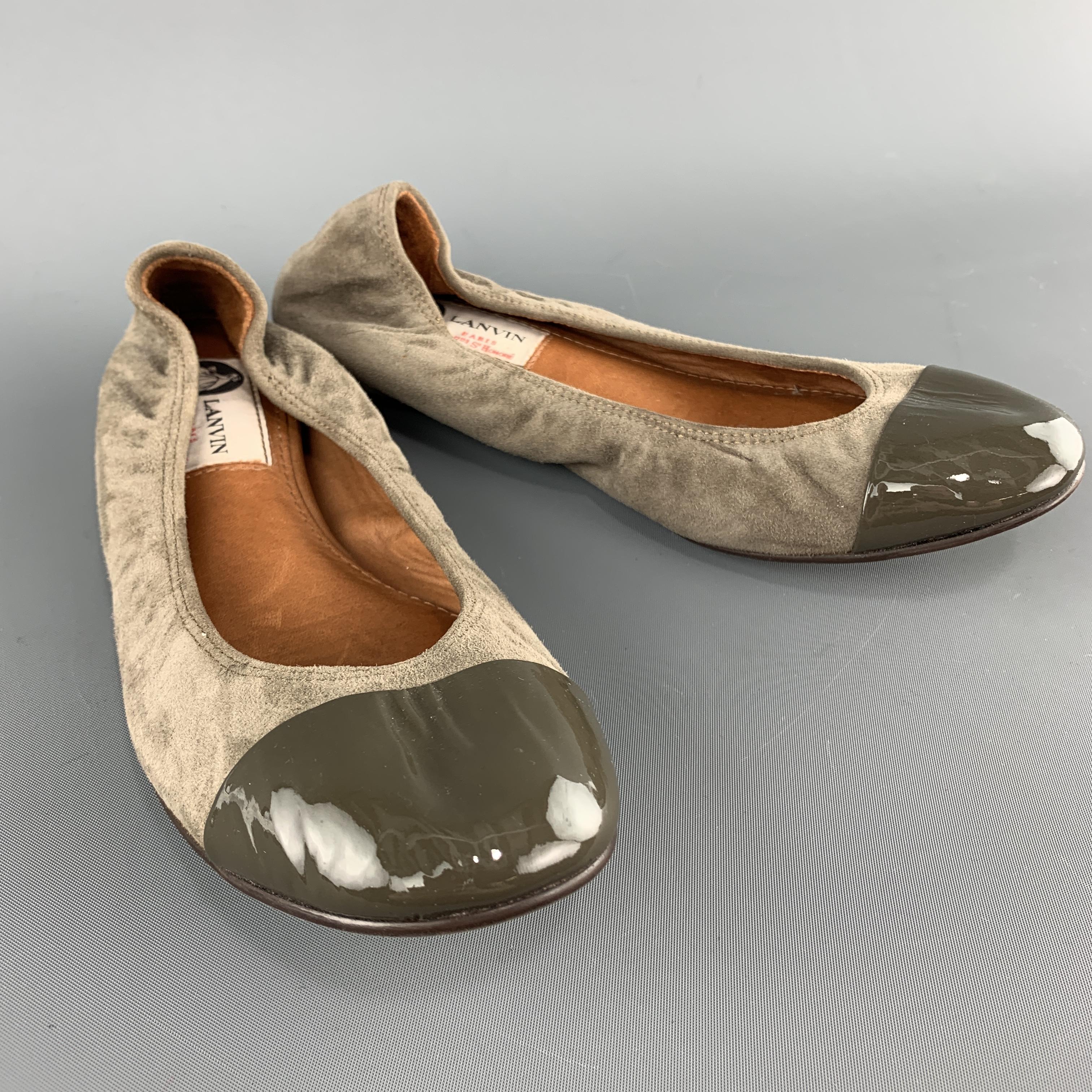 LANVIN flats come in taupe gray suede with a patent leather toe cap. With box. Made in Portugal. 

Very Good Pre-Owned Condition.
Marked: IT 36

Outsole: 9.5 x 3 in.