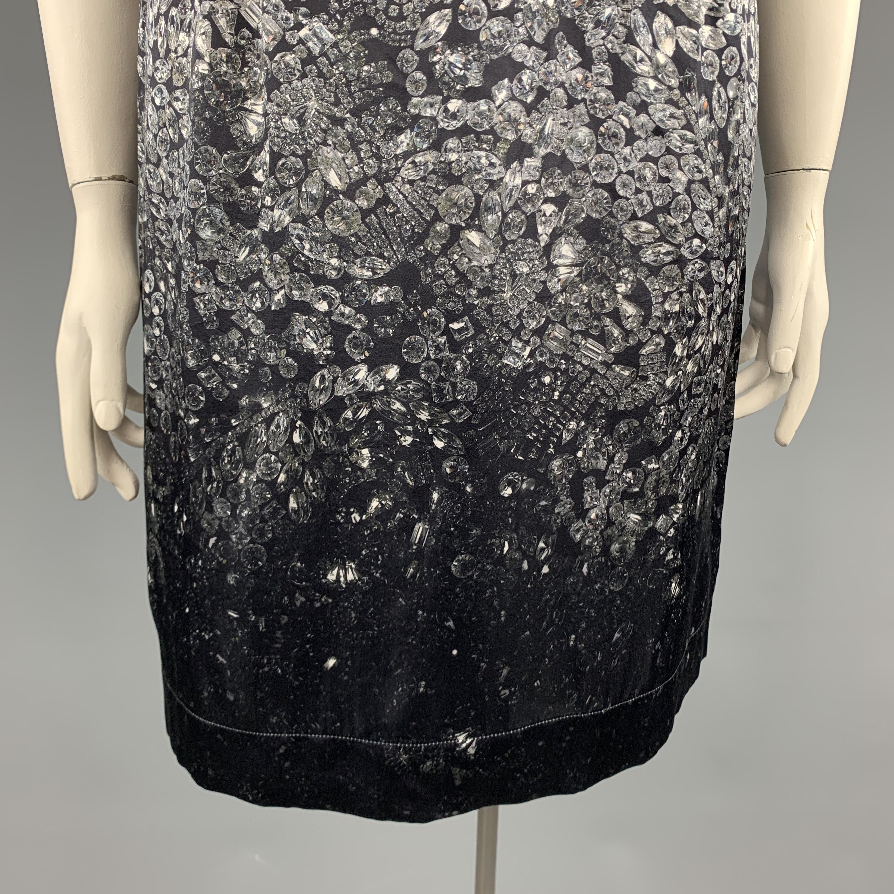 LANVIN sleeveless shift dress comes in a silk blend satin with all over ombre diamonds print and raw stitched edges. 

Excellent Pre-Owned Condition.
Marked: IT 44

Measurements:

l	Shoulder: 16 in.
l	Bust: 40 in.
l	Waist: 32 in.
l	Hip: 43