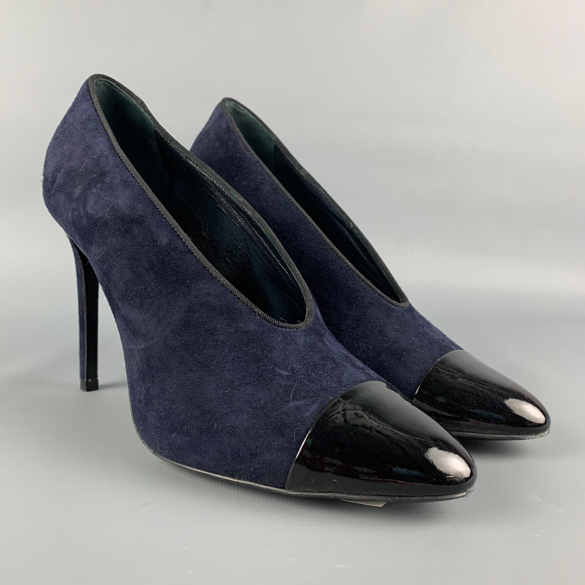 LANVIN pumps comes in a navy suede featuring a black patent leather cap toe an a stiletto heel. Comes with box. Made in Italy.

Very Good Pre-Owned Condition.
Marked: 38
Original Retail Price: $775.00

Measurements:

Heel: 4 in.
 