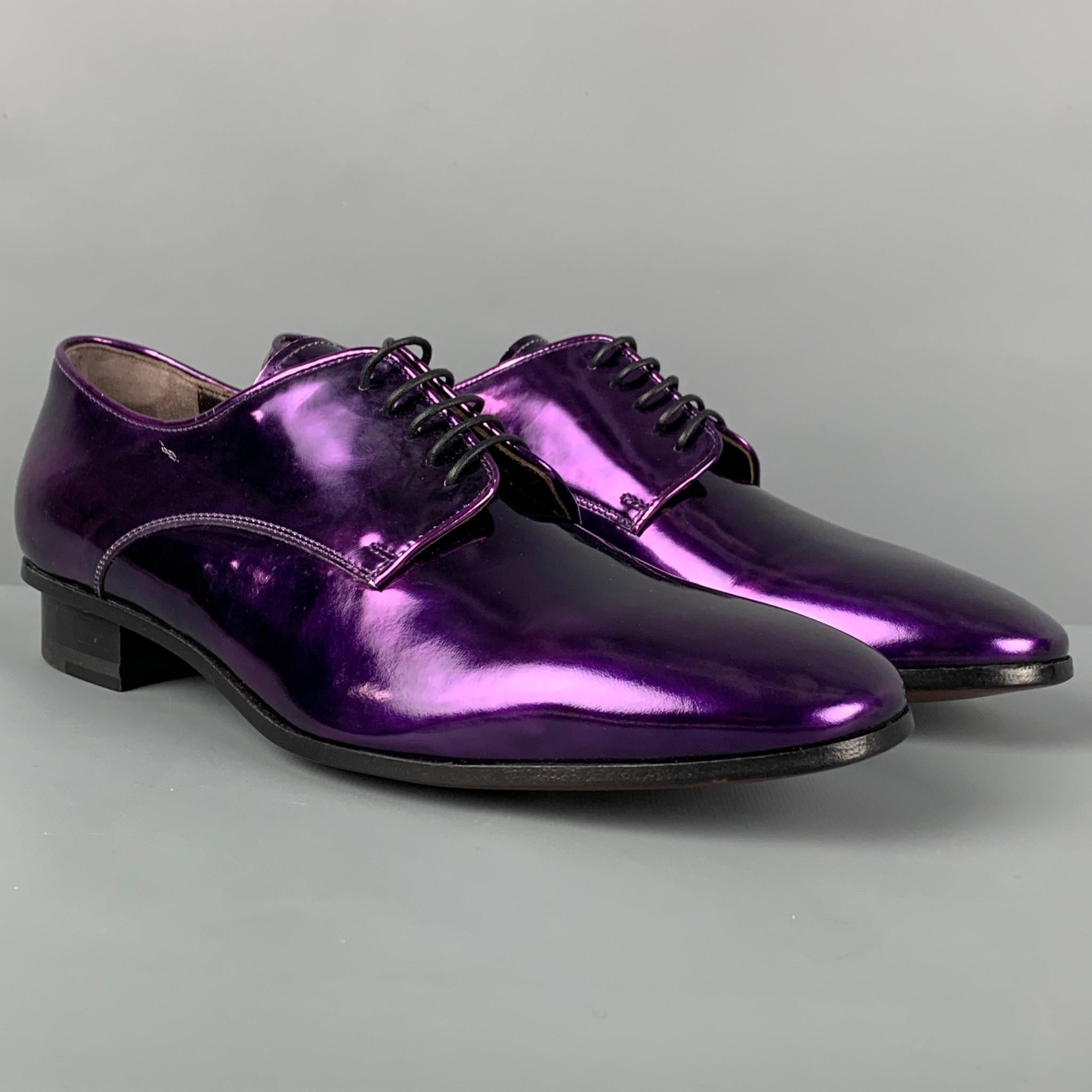 LANVIN shoes comes in a purple metallic leather featuring a classic style and a lace up closure. Comes with box. Made in Italy. 

Excellent Pre-Owned Condition.
Marked: 7.5
Original Retail Price: $865.00

Outsole: 11.25 in. x 4 in. 