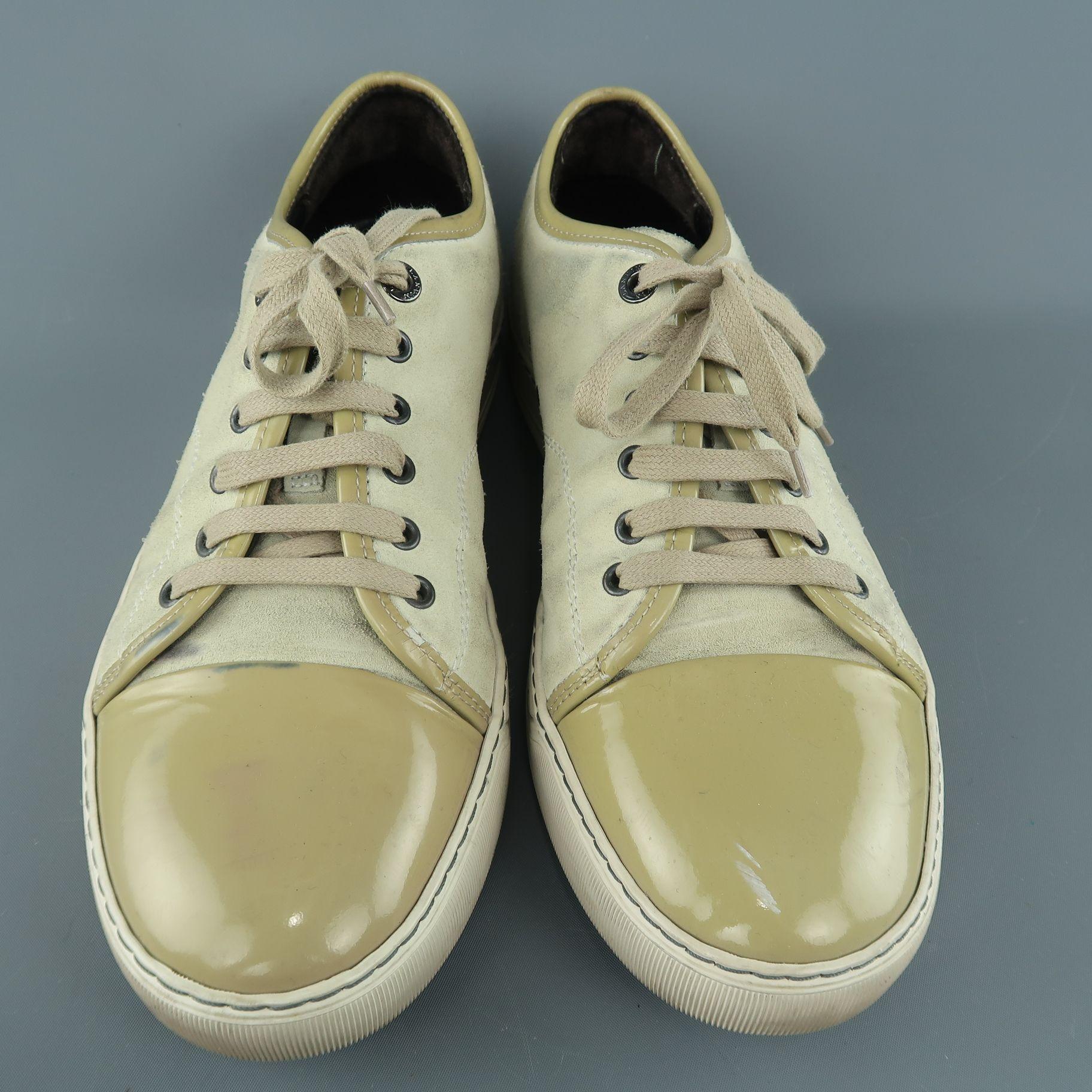 LANVIN low top sneakers come in beige suede with olive beige patent leather cap toe and trim. Wear throughout. As-is. Made in Portugal.

Fair Pre-Owned Condition.
Marked: UK 8

Outsole: 12 x 4.5 in.
