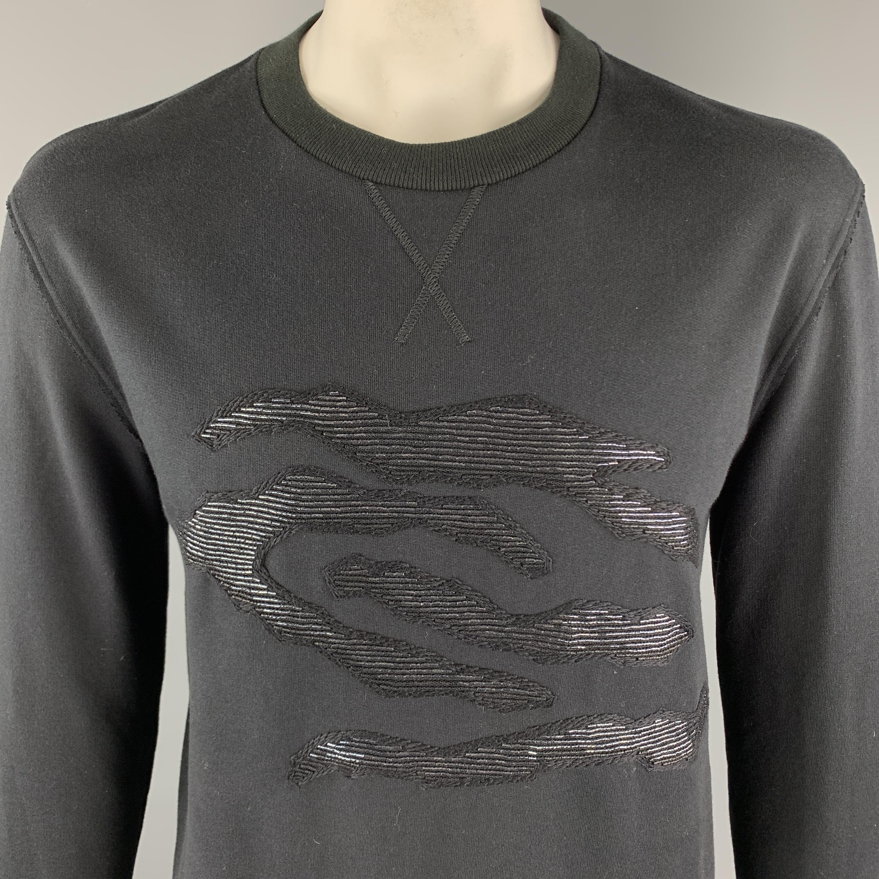 LANVIN Sweatshirt comes in a black tone in a solid cotton material, with a crewneck, a beaded embellishment at front, and ribbed cuffs and hem. Made in Italy.

Excellent Pre-Owned Condition.
Marked: M

Measurements:

Shoulder: 18 in.
Chest: 44 in.