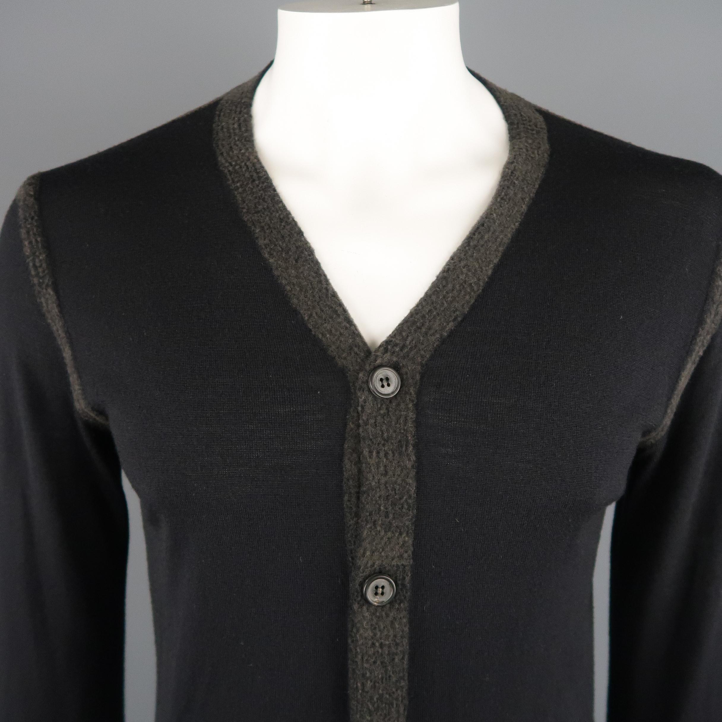 LANVIN Cardigan Sweater comes in a black tone in a solid wool material, with a charcoal trim, buttoned, and with ribbed cuffs and hem. Made in Italy.
 
Excellent Pre-Owned Condition.
Marked: L IT
 
Measurements:
 
Shoulder: 17.5 in.
Chest: 42