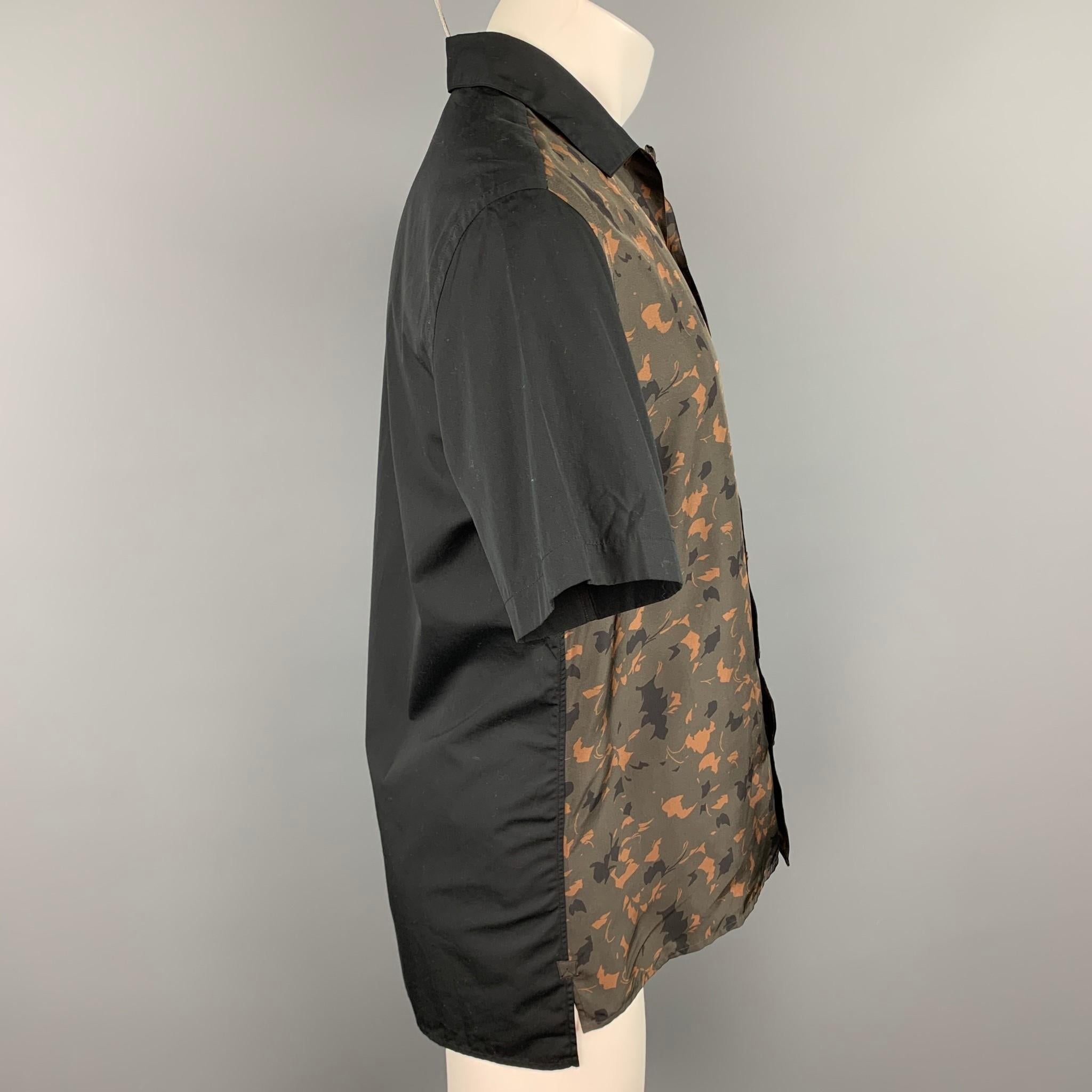 LANVIN short sleeve shirt comes in a black & olive print silk featuring a button up style, front slit pocket, and a spread collar.

New With Tags.
Marked: 38/15

Measurements:

Shoulder: 18.5 in.
Chest: 42 in.
Sleeve: 10 in.
Length: 29.5 in. 