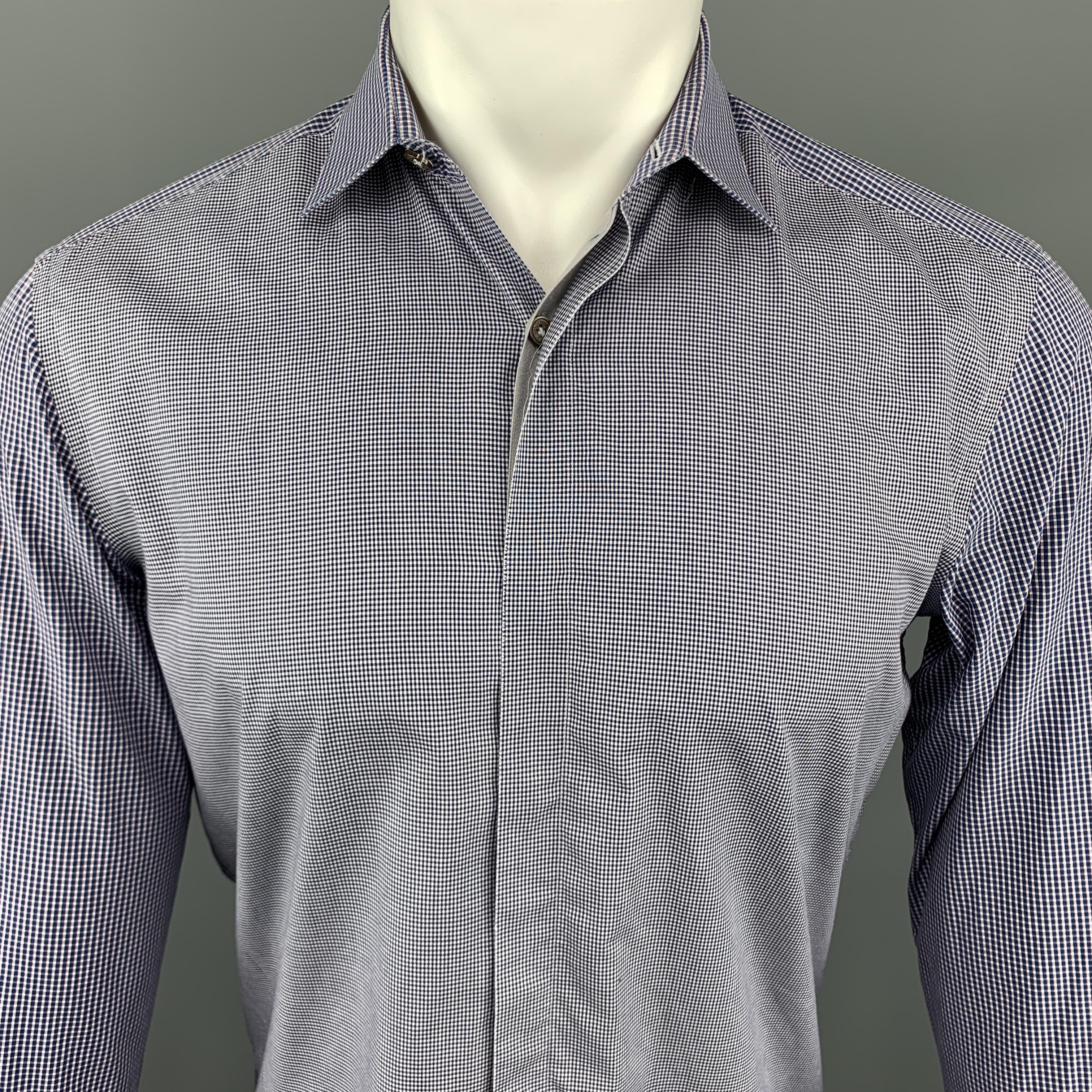 LANVIN Long Sleeve Shirt comes in blue and white tones, in houndstooth cotton material, mixed fabrics, with a classic collar, hidden buttons at closure, a grey trim, and buttoned cuffs. Made in Italy. 

Excellent Pre-Owned Condition.
Marked: 39   15