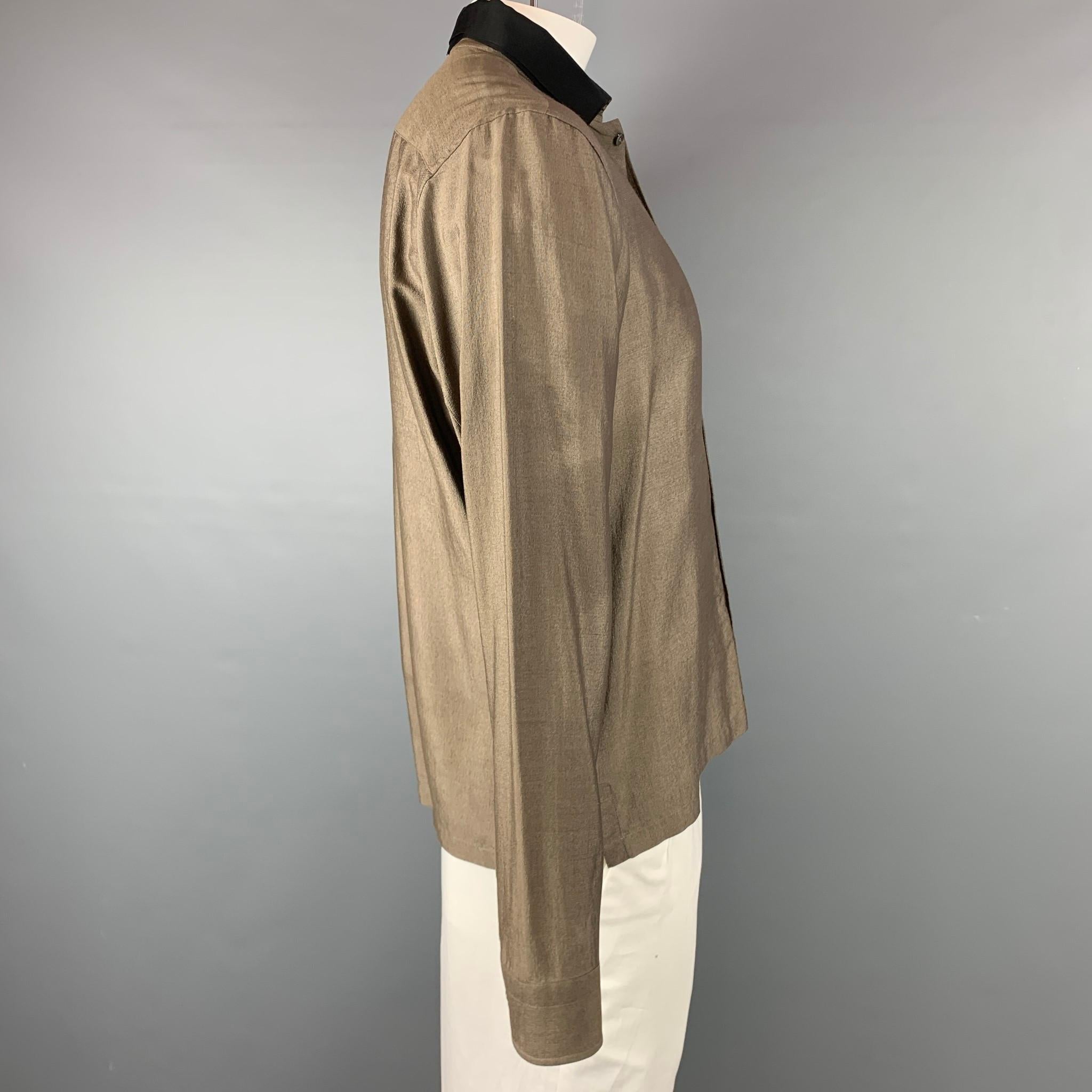 LANVIN long sleeve shirt comes in a olive silk / wool featuring a button up style, patch pocket, and a black spread collar. Made in Italy.

Very Good Pre-Owned Condition.
Marked: 41/16

Measurements:

Shoulder: 18.5 in.
Chest: 44 in.
Sleeve: 27