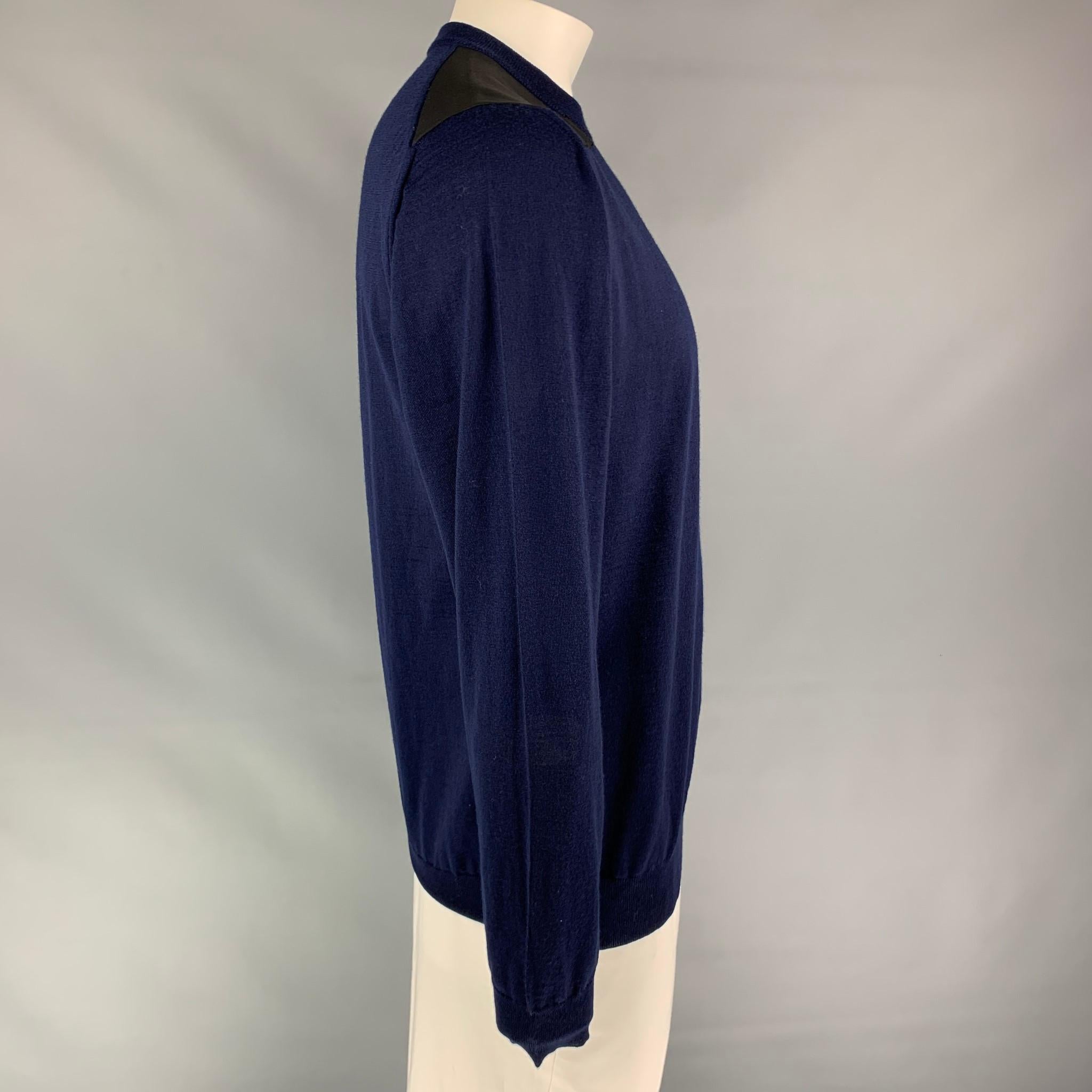 LANVIN pullover comes in a navy knitted wool featuring black shoulder patches and a crew-neck. Made in Italy.

New With Tags. 
Marked: XXL

Measurements:

Shoulder: 17.5 in.
Chest: 44 in.
Sleeve: 28 in.
Length: 28.5 in. 

SKU: 110405
Category: