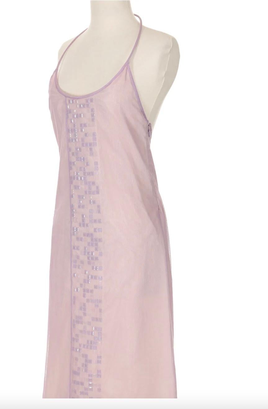 VINTAGE GRACE NY

From a subtly striking collection by Cristina Ortiz, this dress is a timeless & special piece that can be carried through every season. It features a circular fabric covered, wire-type halter that slips over the neck and a