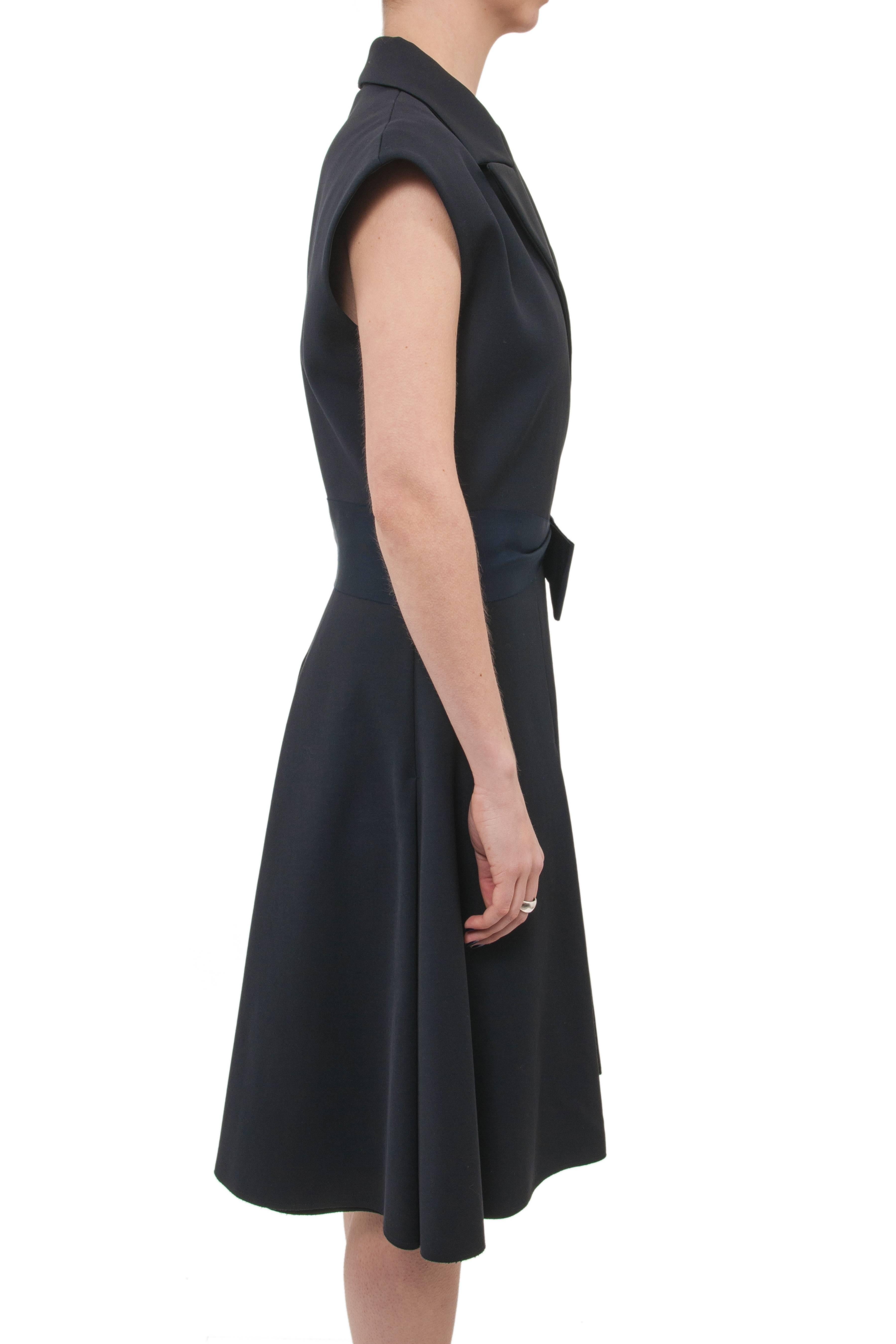 Lanvin Spring 2013 navy tuxedo style dress.  Fitted vest-style bodice and waist with semi-full pleated a-line skirt.  Notched collar, wide grosgrain ribbon waist, exposed metal side zipper.  Marked size FR 38 (but will fit USA 8).  35” bust, 28-29”