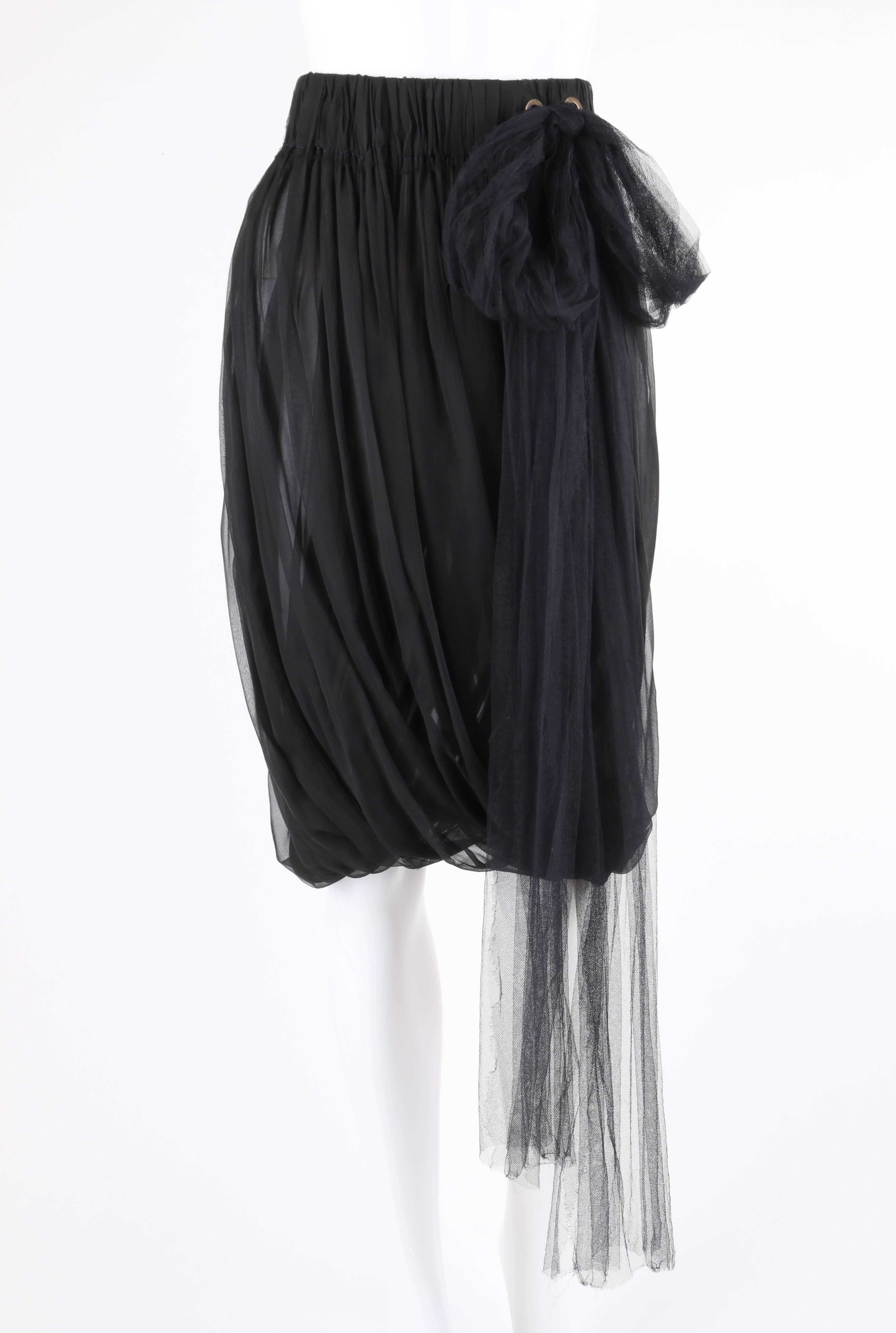 Lanvin Spring/Summer 2006 black semi-sheer silk chiffon pleated bubble skirt. Designed by Alber Elbaz. Pleated black semi-sheer silk crinkle chiffon. Wide elastic waistband with two brass-toned grommets at side. Black silk tulle tie fed through