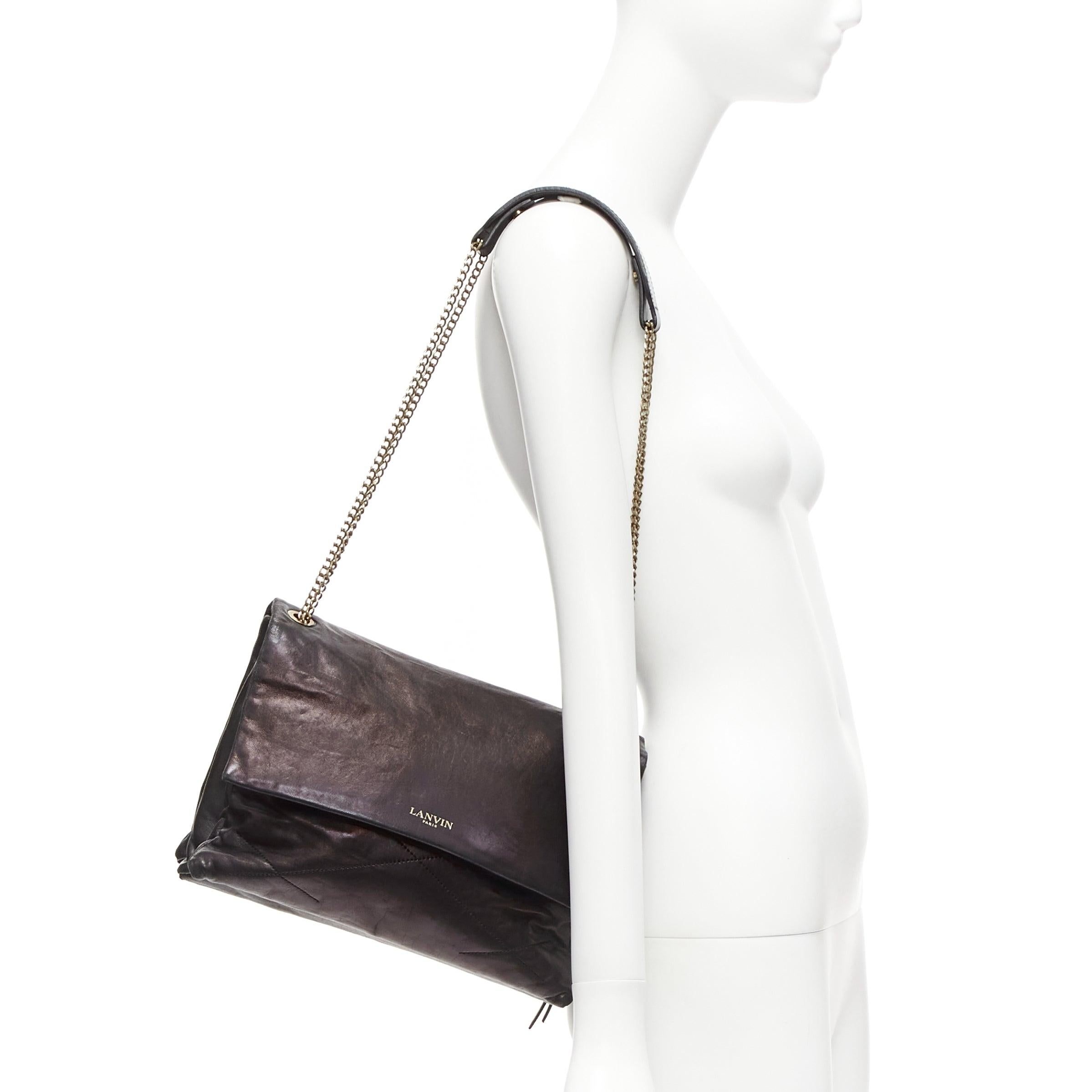 LANVIN Sugar sac à bandoulière en cuir d'agneau souple matelassé à rabat et chaîne, noir
Référence : TGAS/D00975
Marque : Lanvin
Designer : Alber Elbaz
MATERIAL : Cuir
Couleur : noir, or
Motif : Solide
Fermeture : aimant
Doublure : Tissu