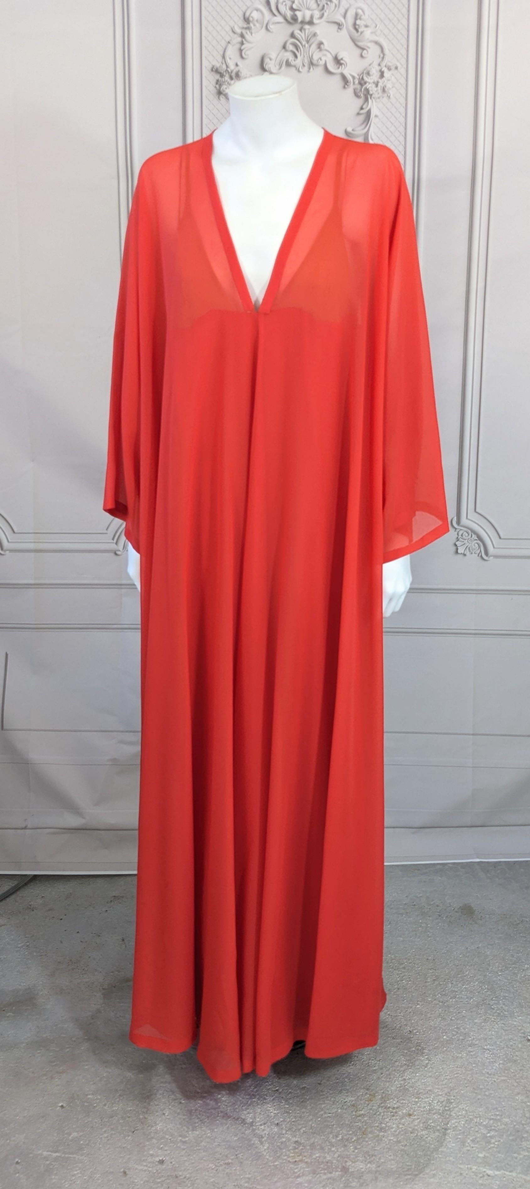 Elegant Tomato Red Lanvin Georgette Caftan from the 1970's France. Oversized sheer rayon georgette caftan slips over the head with a matching slip in rayon crepe and nude chiffon. Slip zips up the side. 1970's France. Size Medium. 