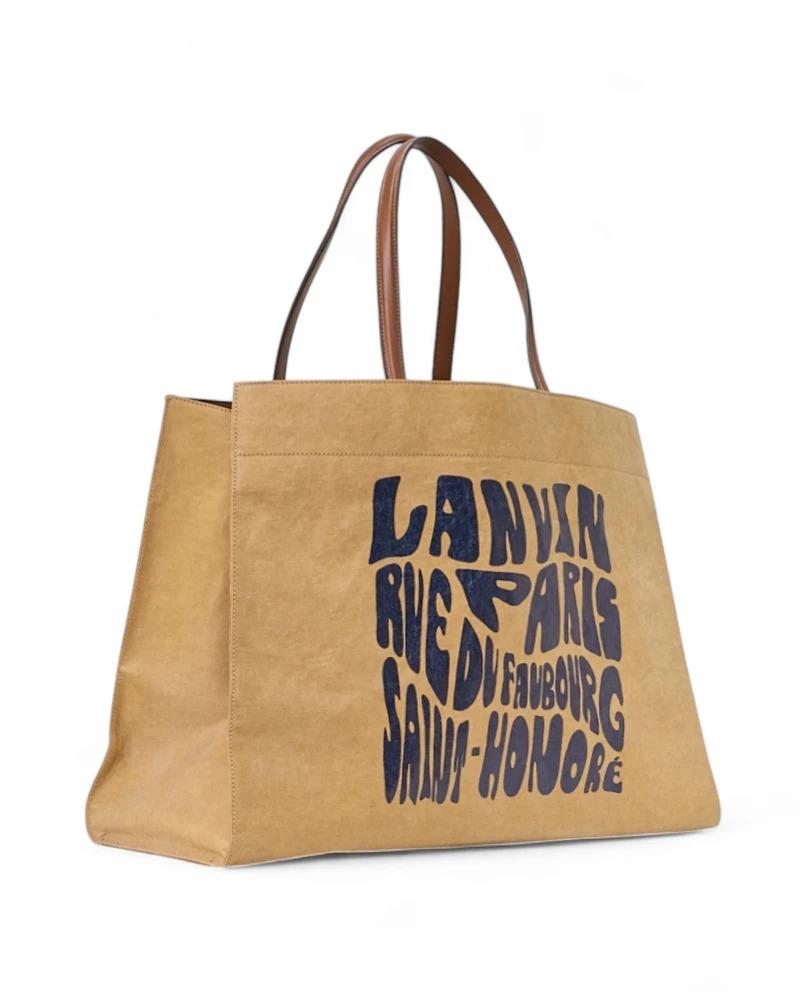 Eine Lanvin Tote Cabas Bag in der Größe Medium, aus weichem Stoff mit Kraftpapier-Effekt, mit braunem Lederbesatz und silberner Hardware.  Sie hat keinen Verschluss, ist innen mit beigem Segeltuch gefüttert und hat eine praktische Tasche, die sehr