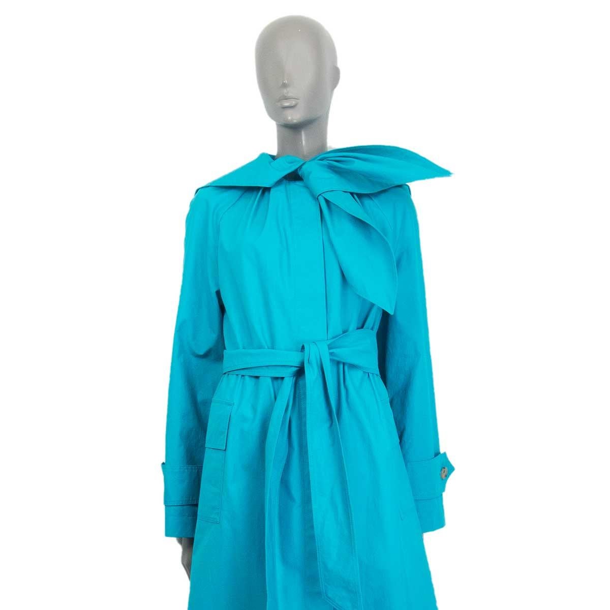100% authentic Lanvin oversized trench coat in teal coated cotton (100%) featuring 6 hidden beige horn buttons and raglan sleeves. Features a bow detail around the neck, flap-pockets on the side, waist-belt and drawstring on the inside. Unlined. Has