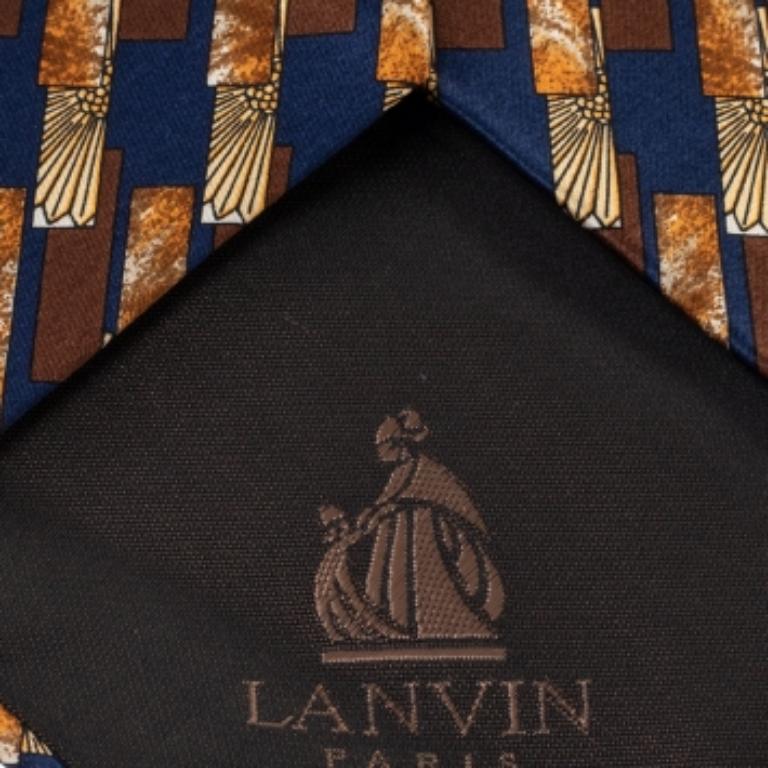 This Lanvin tie is a perfect formal accessory that has a sharp and modern appeal. Made from silk, it features a brown shade, geometric print, and the brand label neatly stitched at the back. It is sure to add oodles of style to your blazers.
