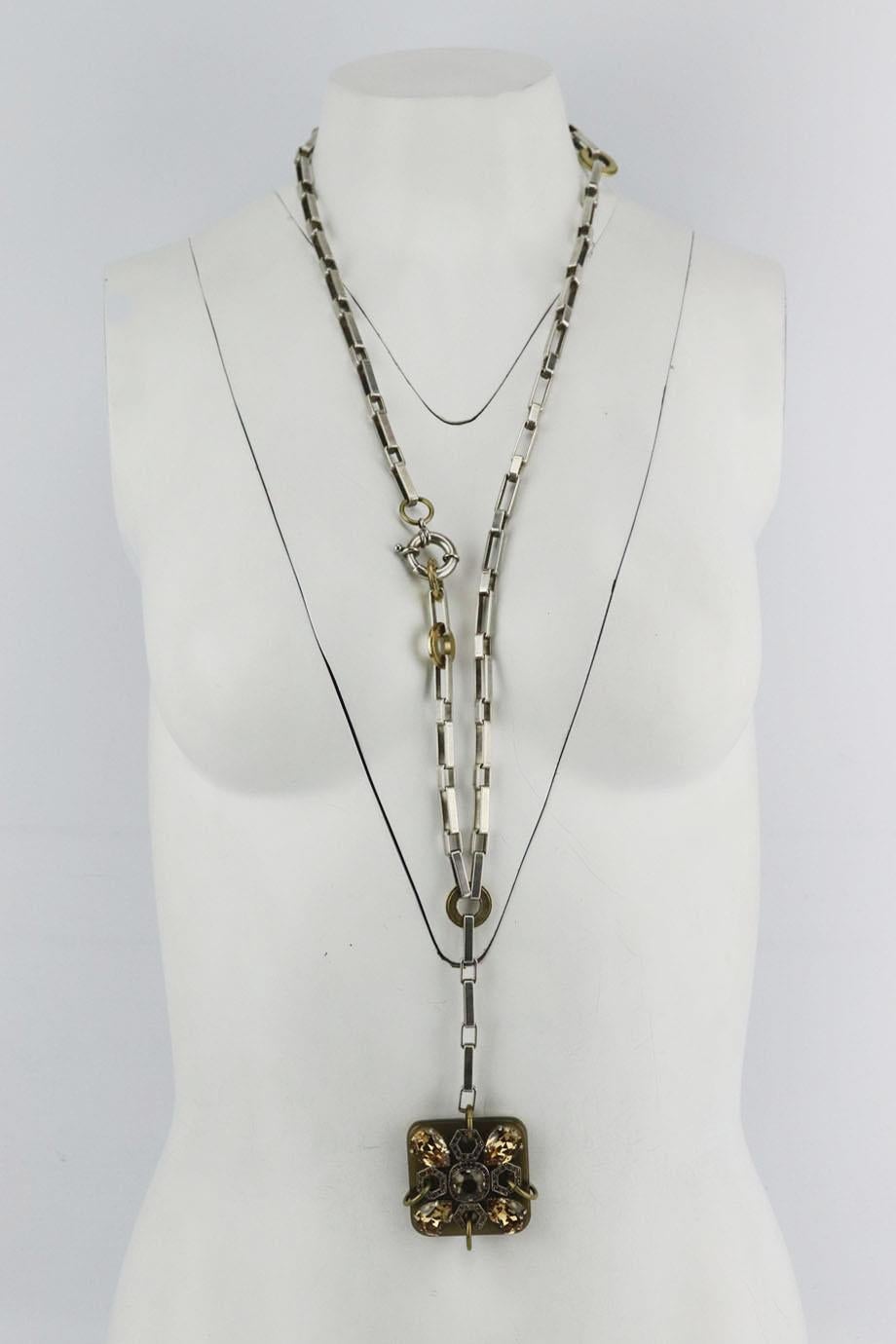 Lanvin vintage silver tone crystal and resin necklace. Silver, gold and light-brown. Clasp fastening at side. Does not come with dustbag or box. Drop: 21 in. Pendant Drop: 1.75 in Very good condition - 1 Pave crystal missing. Some wear to hardware;