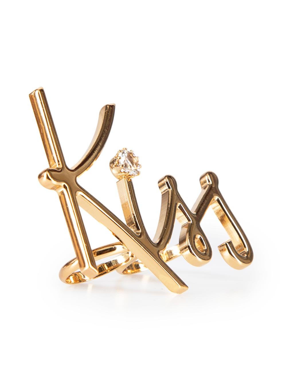 CONDITION is Very good. Minimal wear to ring is evident. Minimal wear to the rear with tiny scratches on this used Lanvin designer resale item.



Details


Gold

Metal

Double ring

'Kiss' Lettering design

Crystal embellishment



 

Made in