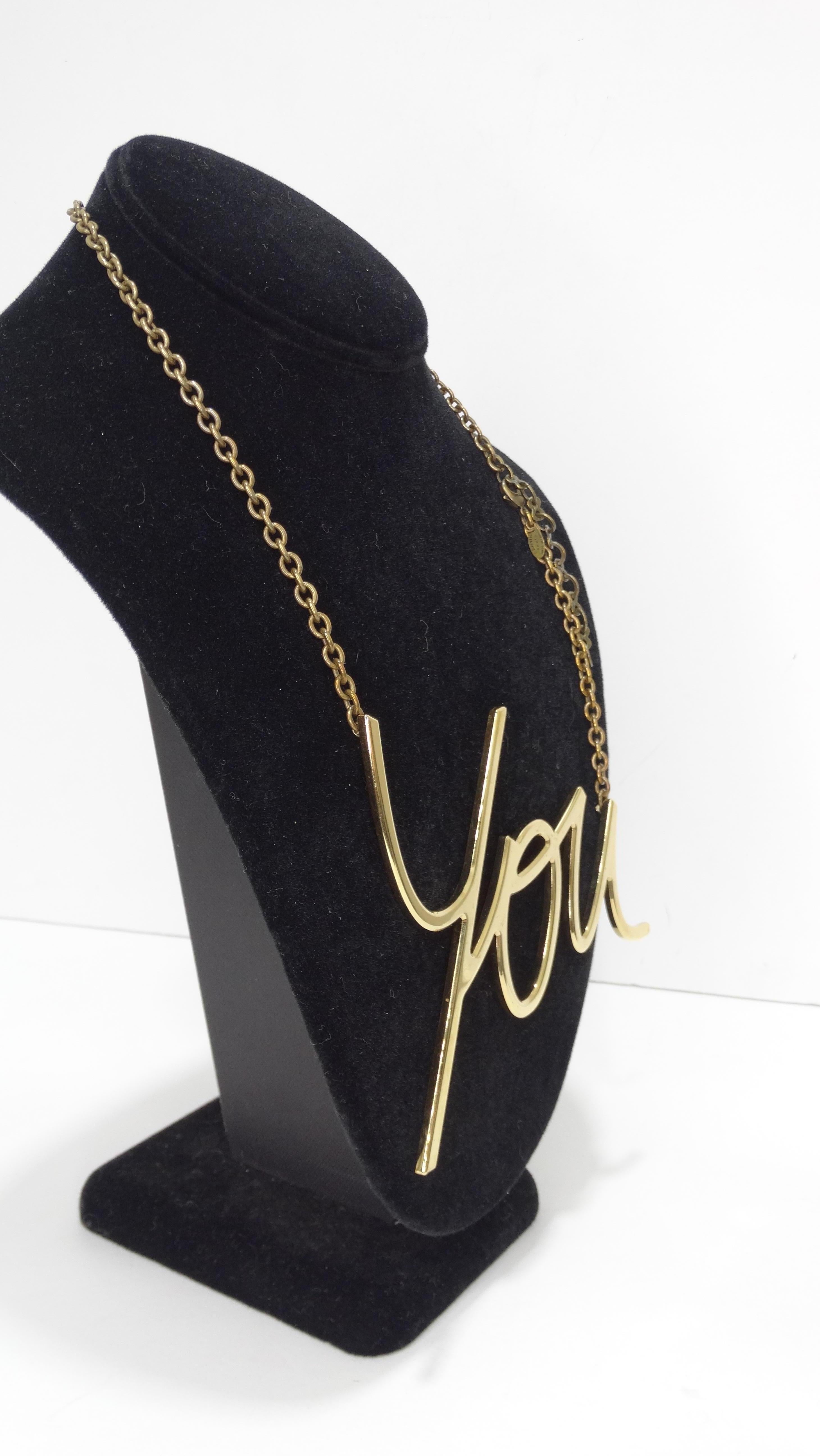 Make a statement with this amazing Albert Elbaz Lanvin necklace! Circa 2013/2014, this gilded metal necklace is plated in 18k gold and features the word 